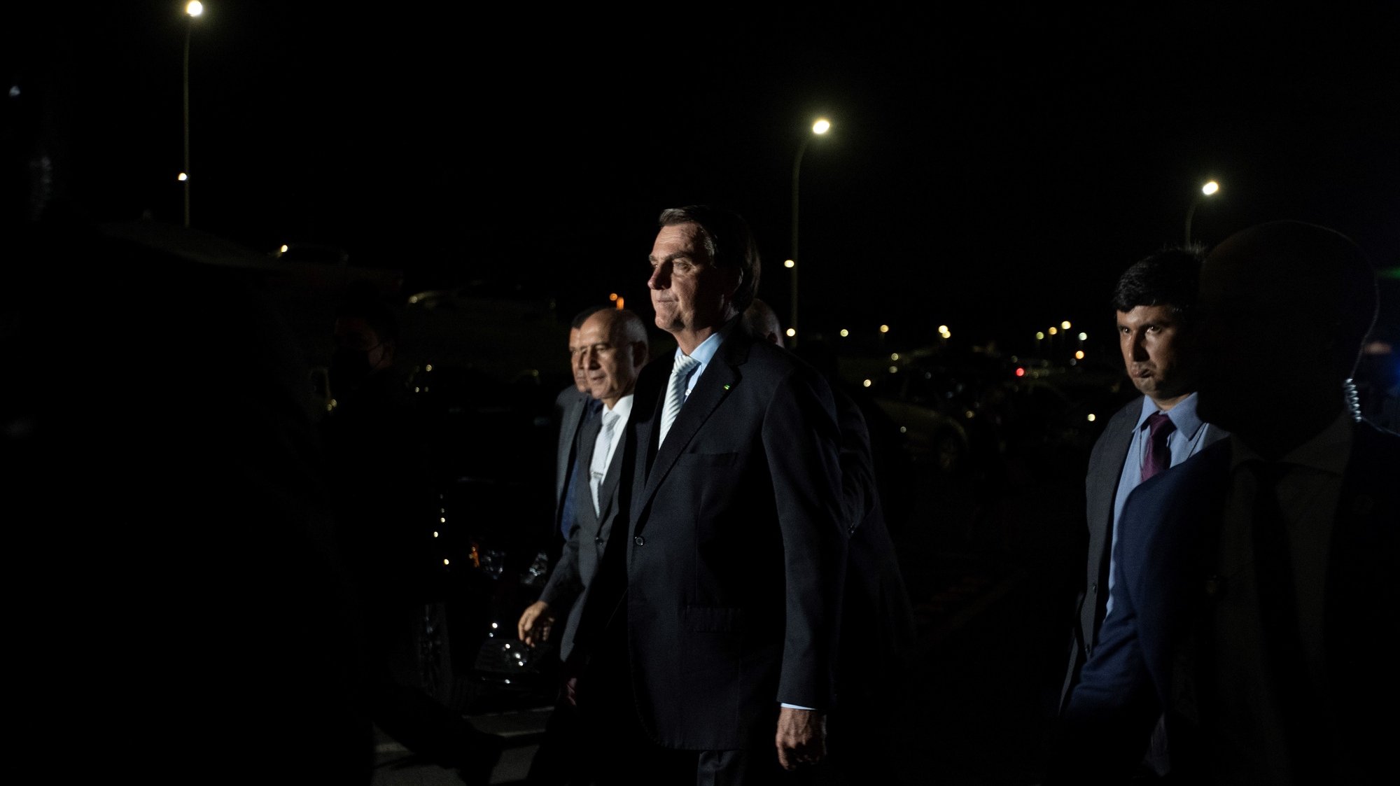 epa09034866 The President of Brazil Jair Bolsonaro (c) leaves the Planalto Palace towards the National Congress building, after the ceremony of approval of the Central Bank Autonomy Law, in Brasilia, Brazil, 24 February 2021. Brazilian President Jair Bolsonaro renewed his Government with changes in two ministries and sanctioned a law that gives autonomy to the Central Bank, which is part of his objective of liberalizing the country&#039;s economy.  EPA/Joedson Alves