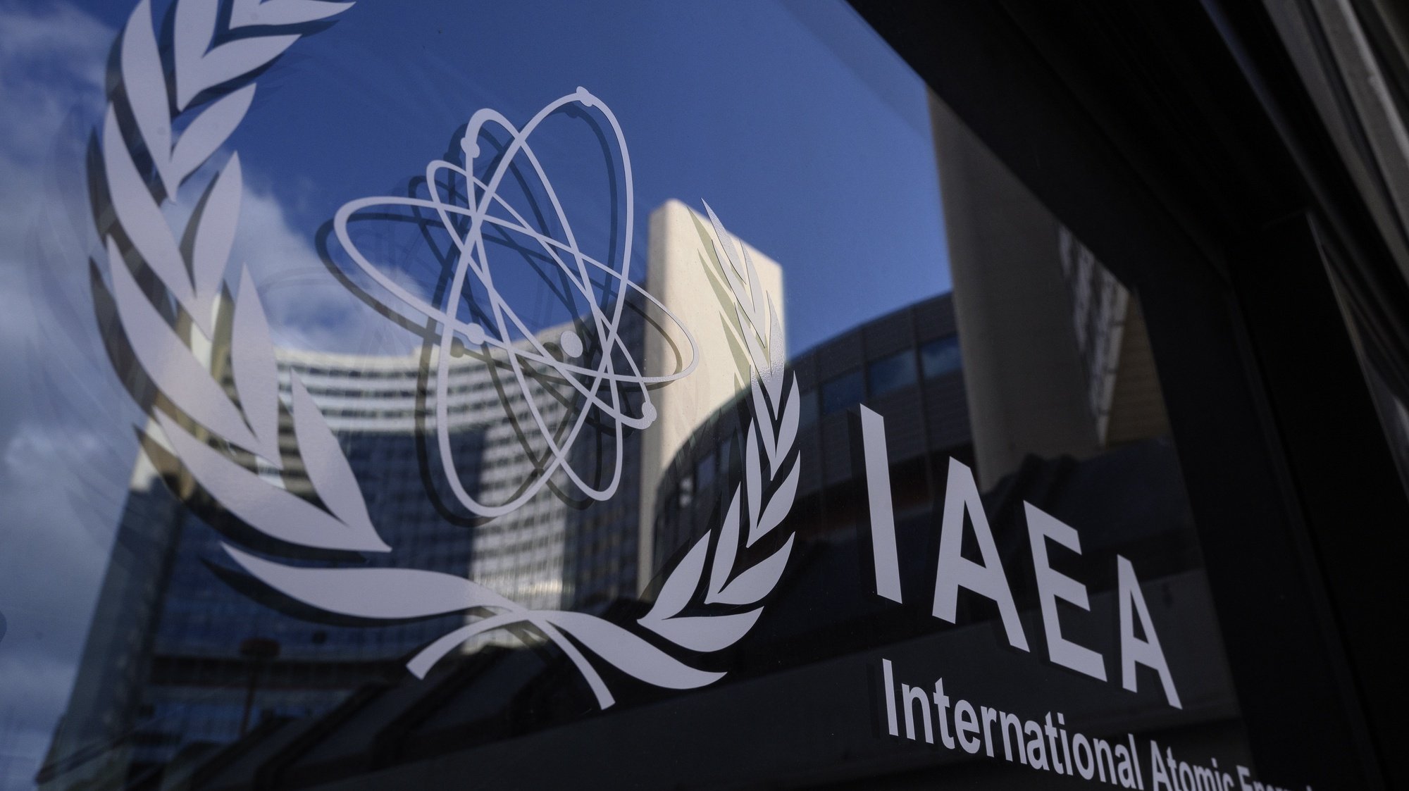 epa09224033 A logo of the International Atomic Energy Agency (IAEA) is seen in front of the IAEA headquarters of the UN seat in Vienna, Austria, 23 May 2021. A press conference of IAEA Director General Rafael Mariano Grossi is expected on 24 May 2021, after consultations with Iran regarding the technical understanding between the IAEA and Iran.  EPA/CHRISTIAN BRUNA