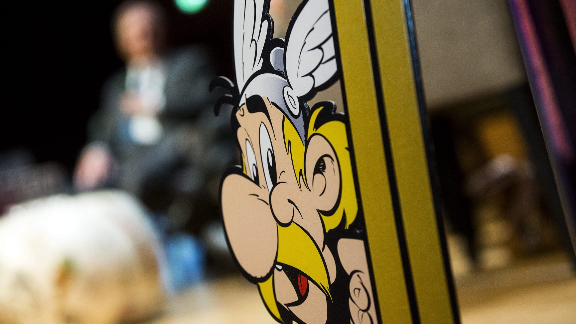 epa04974836 A picture of cartoon character Asterix is displayed during a press conference presenting the 36th album of the adventures of the two Gauls entitled &#039;Le Papyrus de Cesar&#039; (Cesar&#039;s Papyrus) at the Eiffel Tower in Paris, France, 12 October 2015. This album will be released worldwide on 22 October. This is the second album created by French cartoonist Didier Conrad and scenarist Yves Ferri.  EPA/ETIENNE LAURENT