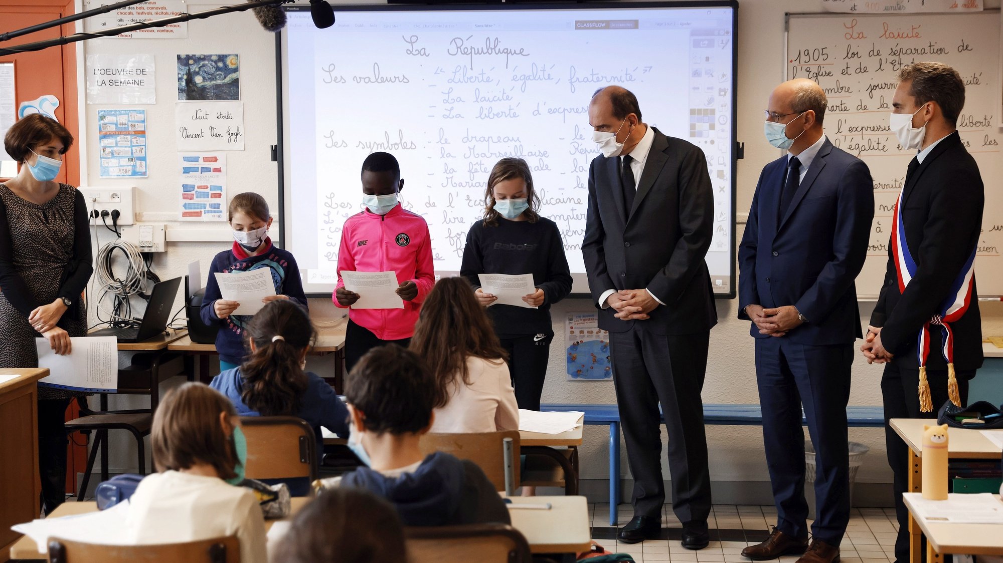 epa08792608 French Prime Minister Jean Castex (C) and French Education, Youth and Sports Minister Jean-Michel Blanquer (2-R) attend a homage to slained French history teacher Samuel Paty, at a school in Conflans-Sainte-Honorine, France, 02 November 2020. Schoolchildren across France were to observe a minute of silence at 11:00 am, as students returned to classes after the autumn break, to remember Samuel Paty, who was killed in Conflans-Sainte-Honorine, outside Paris, on October 16 just as the holiday began. Paty had shown his class a cartoon of the prophet Mohammed for a lesson on freedom of expression, spurring an online campaign targeting him.  EPA/THOMAS COEX / POOL MAXPPP OUT