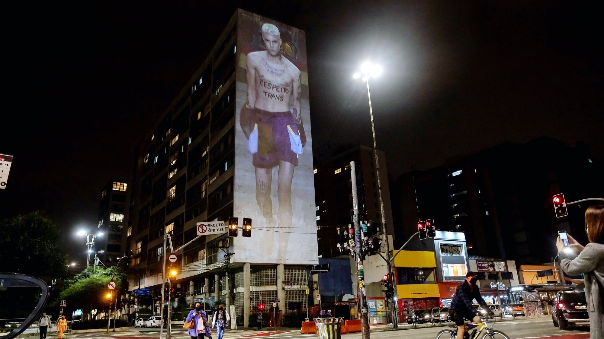epa08799619 A shows is projected of the Sao Paulo Fashion Week onto the facade of a building on Paulista Avenue in Sao Paulo, Brazil, 04 November 2020. Sao Paulo Fashion Week is in its 25th year.  EPA/Sebastiao Moreira