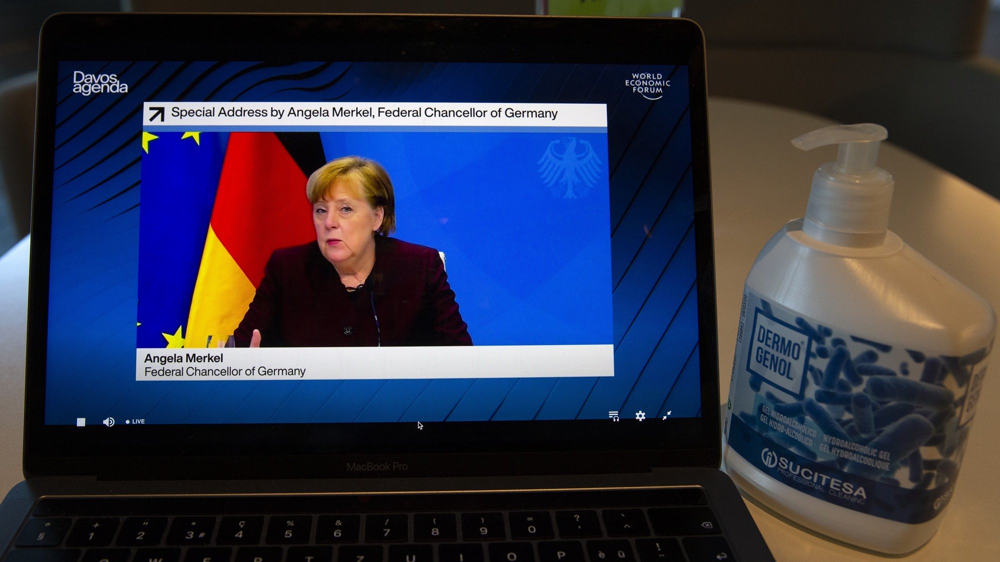 epa08966411 A screen shows German Chancellor Angela Merkel addressing her statement during a videoconference at the Davos Agenda, in Cologny near Geneva, Switzerland, 26 January 2021. The Davos Agenda, from 25 to 29 January 2021, is talking place in an online format due to the coronavirus pandemic.  EPA/SALVATORE DI NOLFI