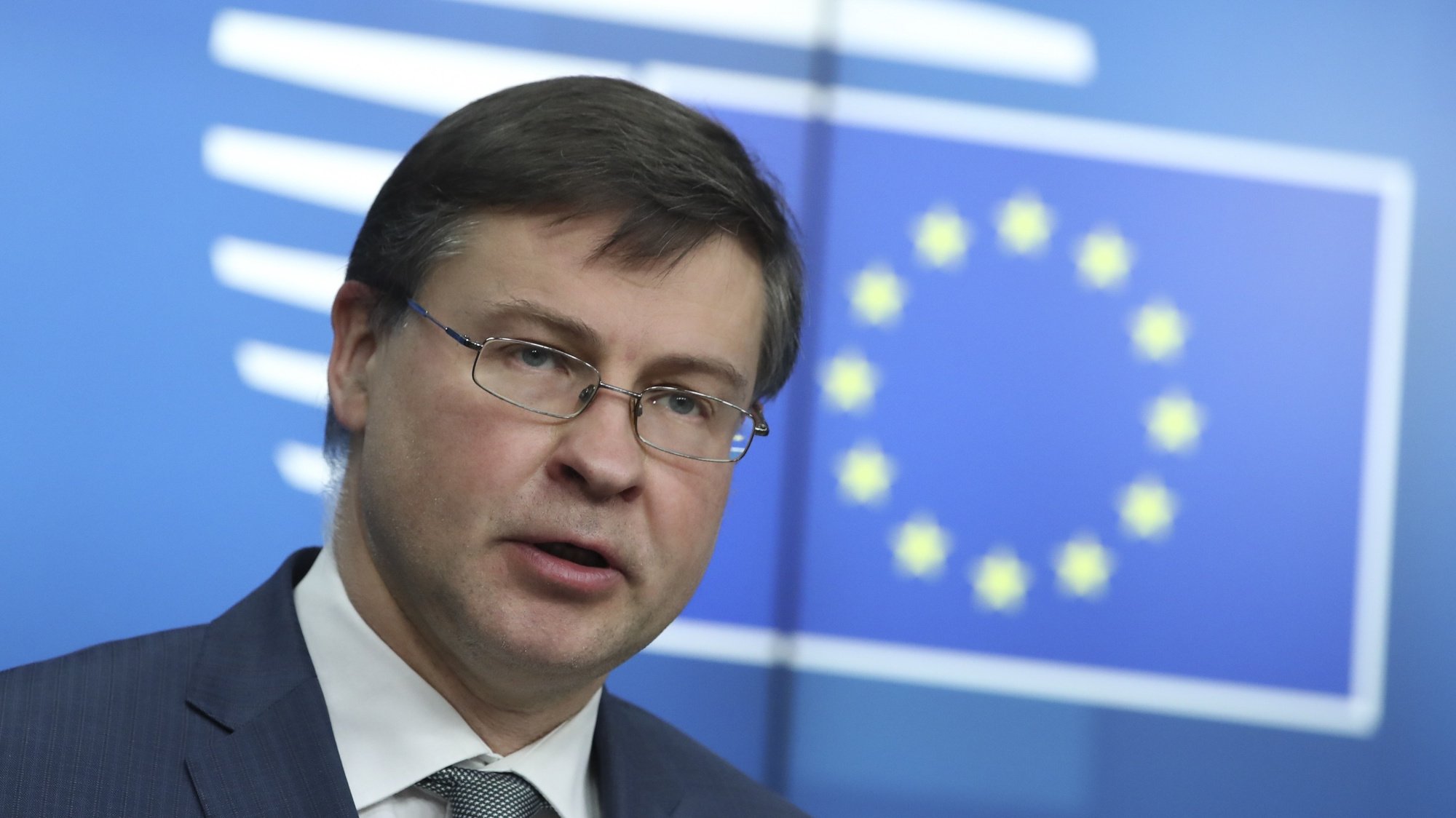 epa09077911 European Commission Vice-President Valdis Dombrovskis speaks during a news conference following a European Union finance ministers meeting in Brussels, Belgium, 16 March 2021.  EPA/YVES HERMAN / POOL
