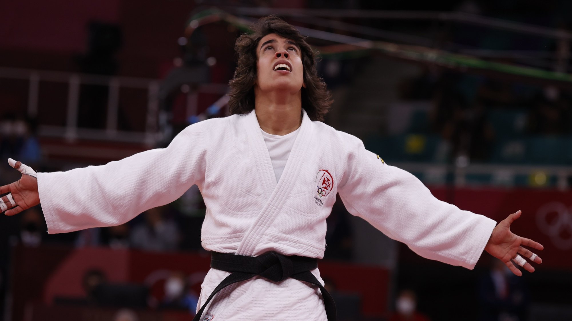 epa09361400 Catarina Costa of Portugal celebrates after defeating Paula Pareto of Argentina during their Repechage bout in the Women -48 kg at the Judo competitions of the Tokyo 2020 Olympic Games at the Nippon Budokan arena in Tokyo, Japan, 24 July 2021.  EPA/JEON HEON-KYUN