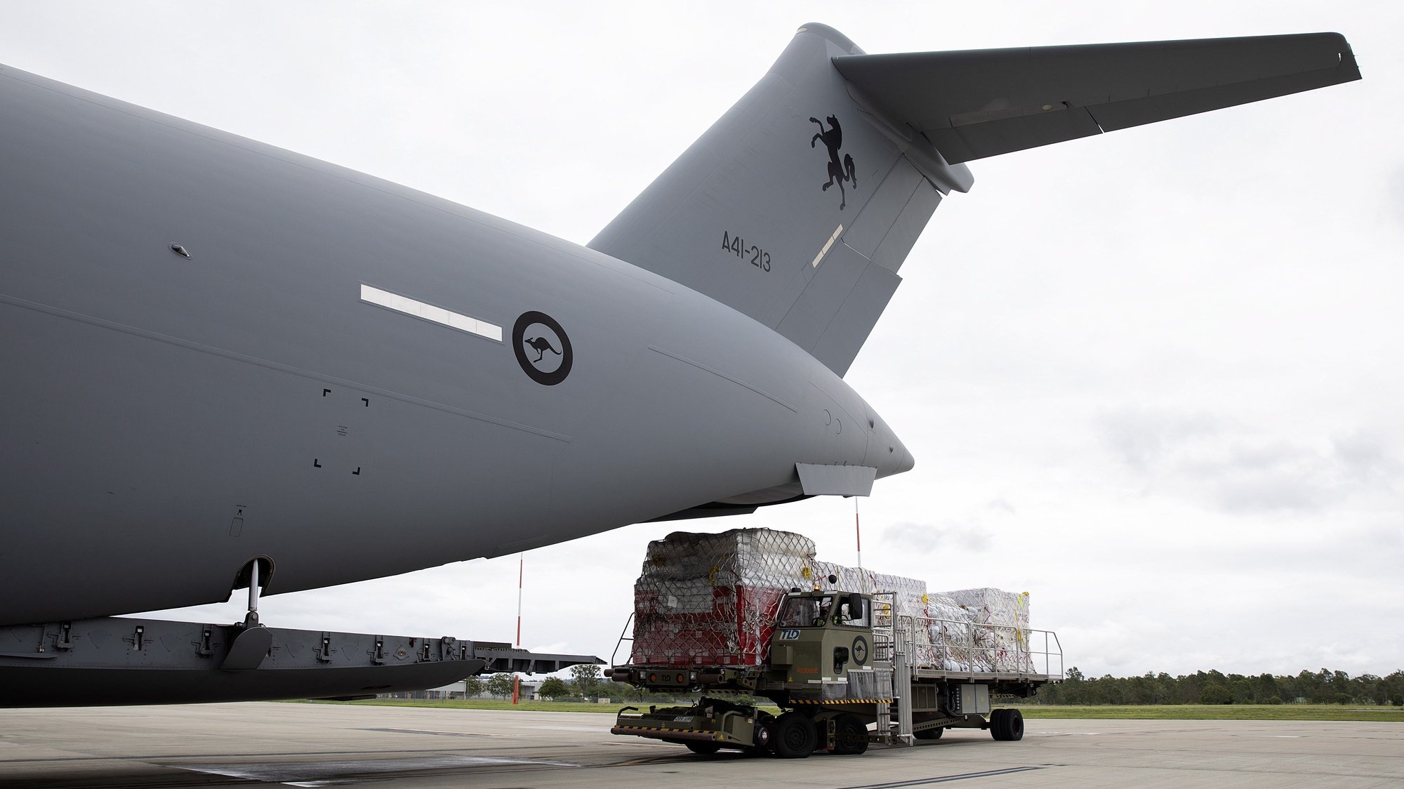 epa09696750 A handout photo made available by the Australian Government Department of Defence (DoD) shows Air Force Air Movements Operators from No. 23 Squadron loading humantarian assistance supplies bound for Tonga onto a C-17A Globemaster III strategic transport aircraft at Royal Australian Air Force (RAAF) Base Amberley, Queensland, Australia, 20 January 2022, following the eruption of Tonga&#039;s Hunga Tonga- Hunga Ha&#039;apai underwater volcano on 15 January.  EPA/LACW KATE CZERNY/RAAF HANDOUT -- MANDATORY CREDIT: COMMONWEALTH OF AUSTRALIA 2022, DEPARTMENT OF DEFENCE -- HANDOUT EDITORIAL USE ONLY/NO SALES *** Local Caption *** The Australian Defence Force is supporting the Department of Foreign Affairs and Trade (DFAT) coordinated mission to support the Government of Tonga following the eruption of Tongaâ€™s Hunga Tonga-Hunga Haâ€™apai underwater volcano on 15 January. 

Royal Australian Air Force C-17 Globemaster III strategic airlift aircraft are now flying humanitarian assistance supplies to Tonga as part of Operation Tonga Assist 22.
