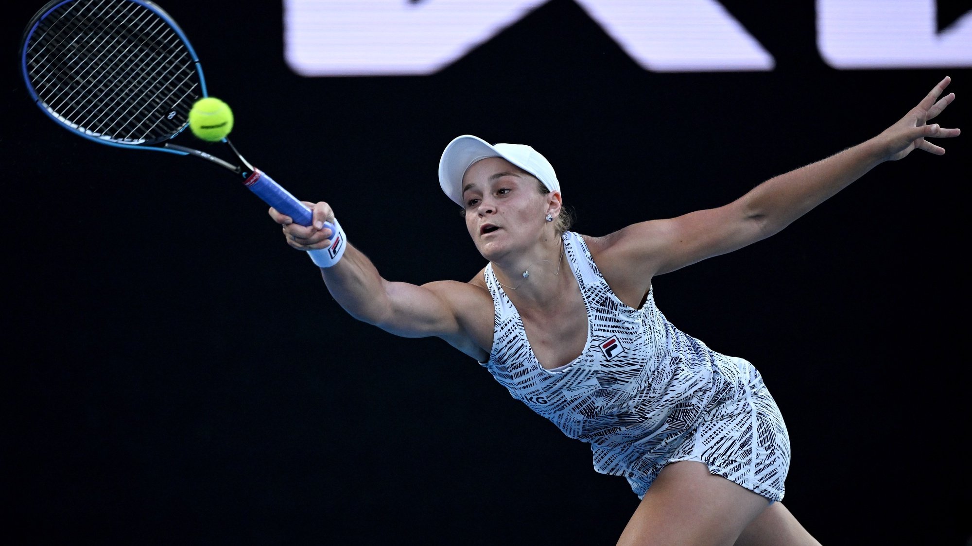 epa09707662 Ashleigh Barty of Australia plays a shot during her quarter final match against Jessica Pegula of the US at the Australian Open Grand Slam tennis tournament at Melbourne Park, in Melbourne, Australia, 25 January 2022.  EPA/DEAN LEWINS AUSTRALIA AND NEW ZEALAND OUT