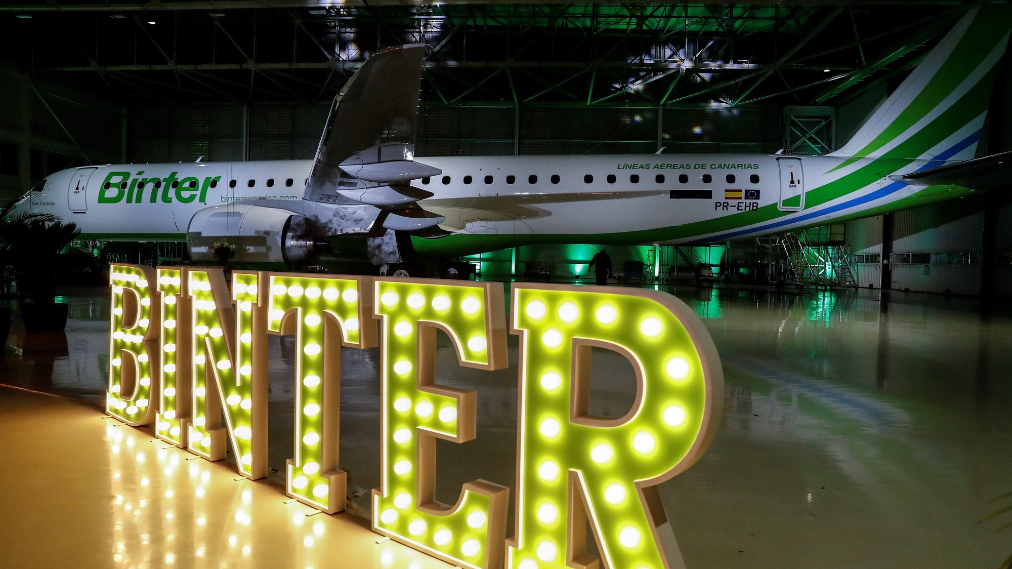 epa08016068 View of the E195-E2 aircraft produced by Brazilian aerospace conglomerate Embraer for Binter Canarias airline, at the Embraer headquarters in Sao Jose dos Campos, Brazil, 21 November 2019. The Brazilian aircraft manufacturer Embraer delivered on 21 November the first five E195-E2 aircrafts to the Spanish airline as part of Binter&#039;s plan of expanding long-distance flights.  EPA/SEBASTIAO MOREIRA