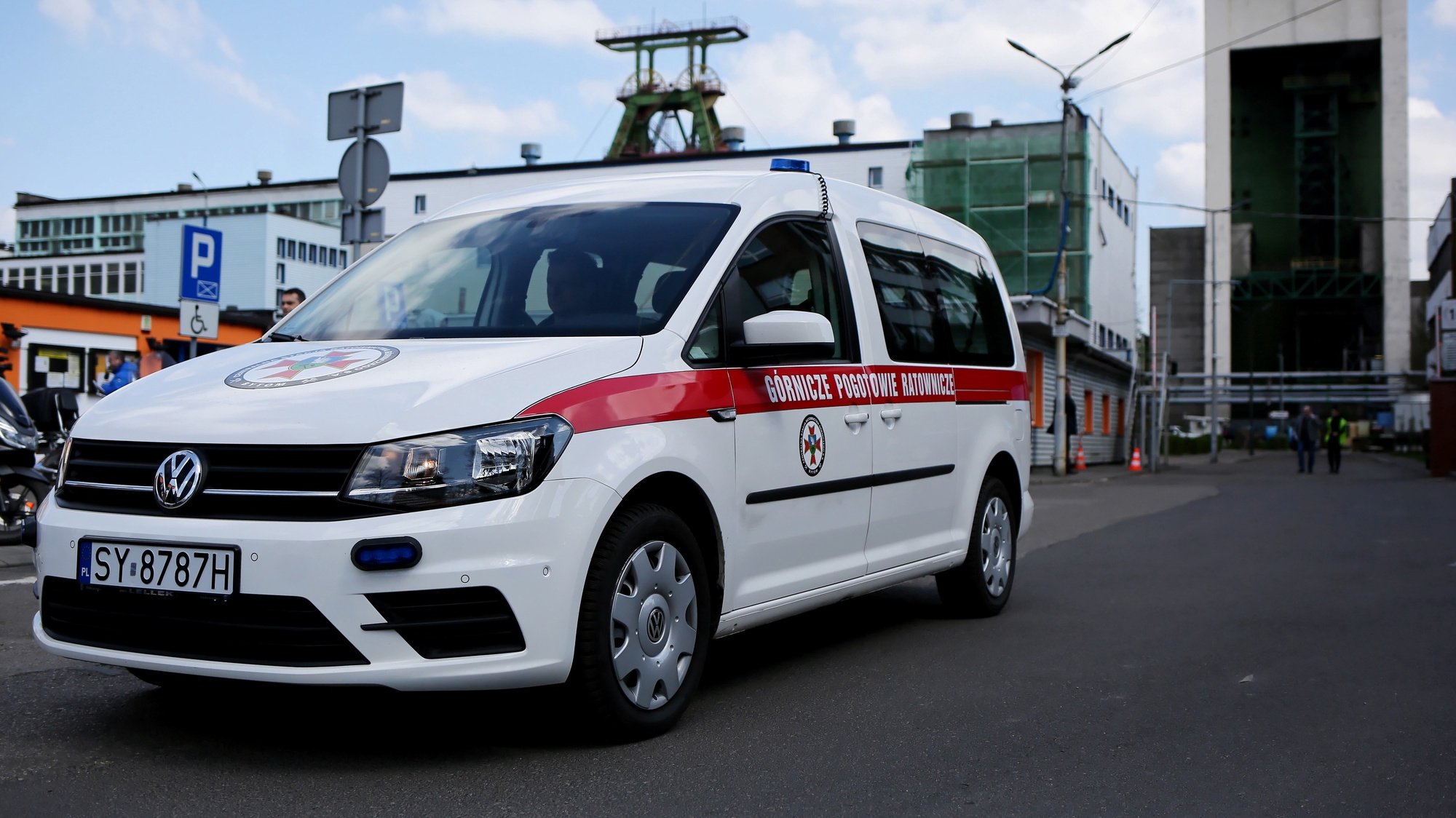 epa09903915 An ambulance in front of the Zofiowka coal mine in Jastrzebie-Zdroj, southern Poland, 23 April 2022. A tremor shook the Zofiowka coal mine in the early hours on 23 April, leaving ten miners missing, according to a statement by the mining conglomerate JSW, the mine owner. The tremor involved &#039;an intensive outflow of methane&#039;, JSW said. Twelve rescue teams have been trying to reach the missing miners. High concentration of methane may hinder the rescue operation as the pipeline supplying fresh air to the location has been damaged. A rescue operation is currently underway.  EPA/Zbigniew Meissner POLAND OUT