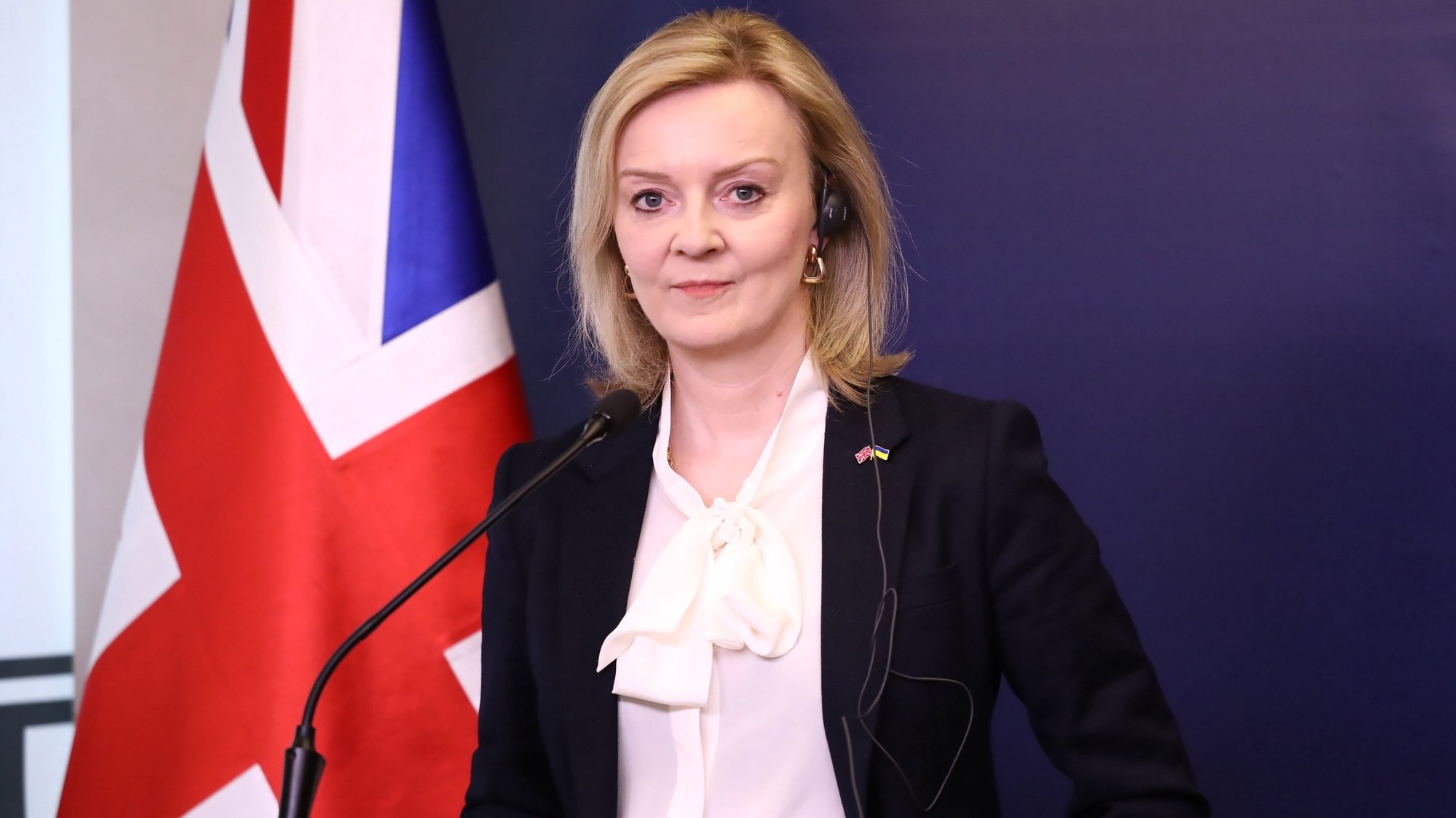 epa09872561 British Foreign Secretary Liz Truss and Polish Foreign Minister Zbigniew Rau (not pictured) during a press conference after their meeting at the headquarters of the Polish Foreign Ministry in Warsaw, Poland, 05 April 2022.  EPA/Tomasz Gzell POLAND OUT
