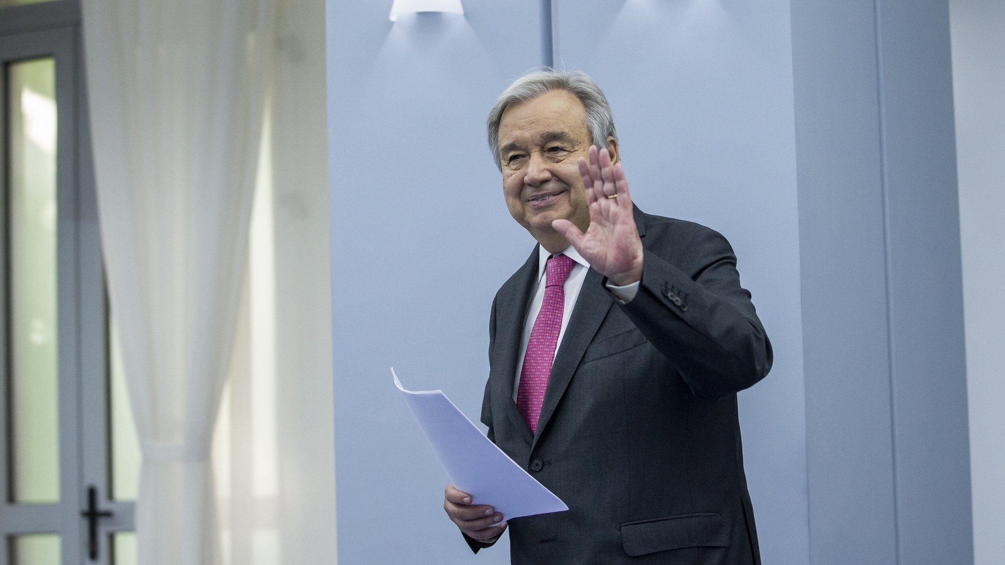 epa09936610 UN Secretary-General Antonio Guterres waves to media after a joint press conference with Moldovan Prime Minister Natalia Gavrilita (not seen) during his two-day official visit in the government building in Chisinau, Moldova, on 09 May 2022.  EPA/DUMITRU DORU