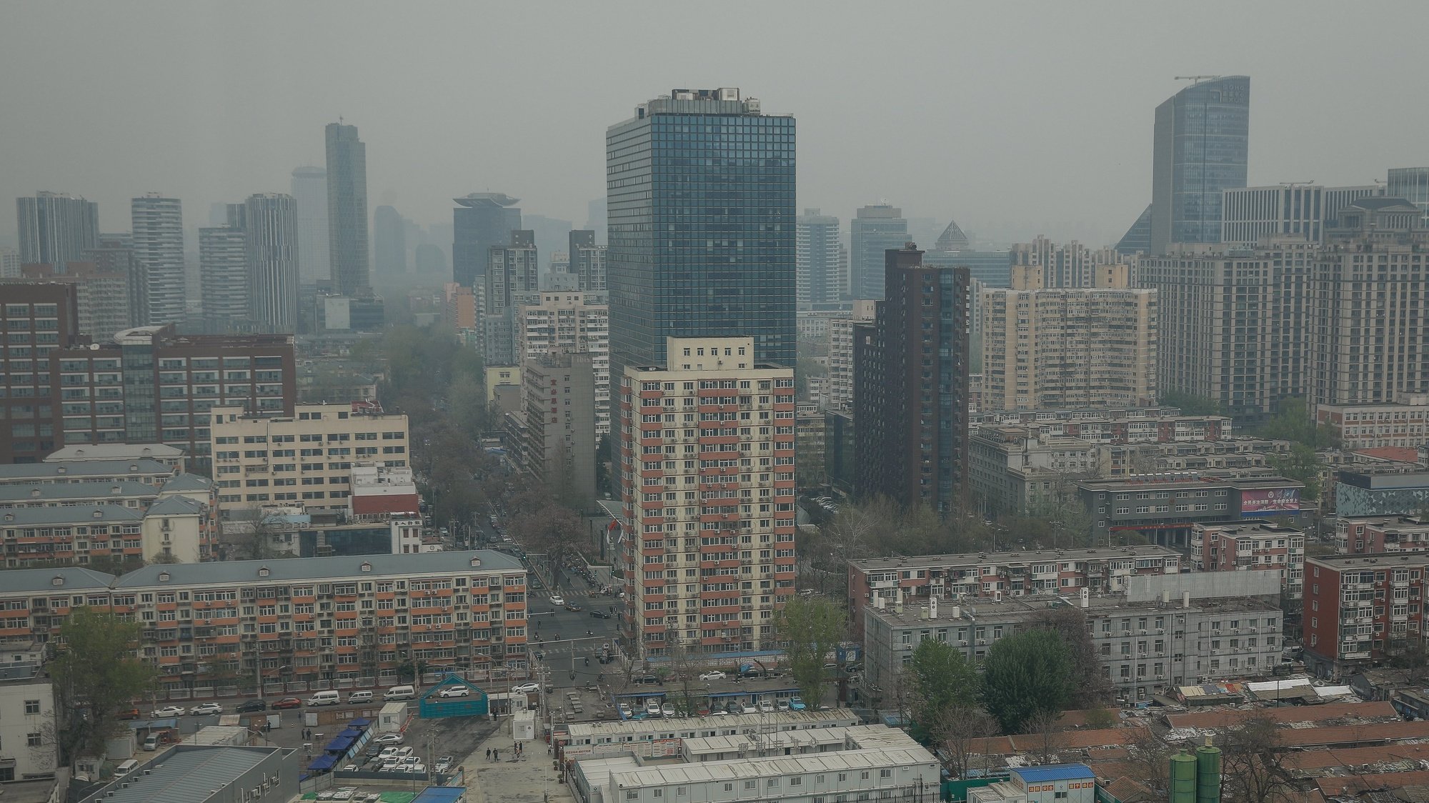 epa09884222 A view of apartments and office buildings in Beijing, China, 11 April 2022. China&#039;s consumer price index (CPI), a gauge for inflation, rose 1.5 percent year on year in March, up from 0.9 percent growth in February. The increase is driven by the rising cost of global commodities as well as epidemic outbreaks, the National Bureau of Statistics (NBS) said.  EPA/MARK R. CRISTINO