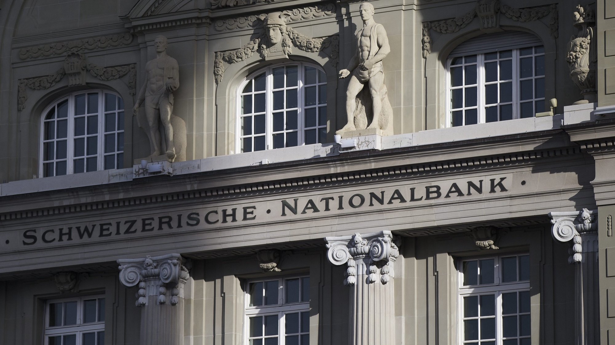 epa04561127 The Swiss National Bank, SNB, photographed in Bern, Switzerland, 15 January 2015. The euro dropped to its lowest level since November 2003 on 15 January 2015, after the Swiss central bank announced that it would give up its minimum exchange rate of 1.20 Swiss francs per euro. The euro intermittently fell to 1.1575 US dollars, down from a rate of 1.1735 US dollars the day before. Switzerland had been buying euros in order to prevent the franc from becoming too strong and hurting its export industry.  EPA/PETER KLAUNZER