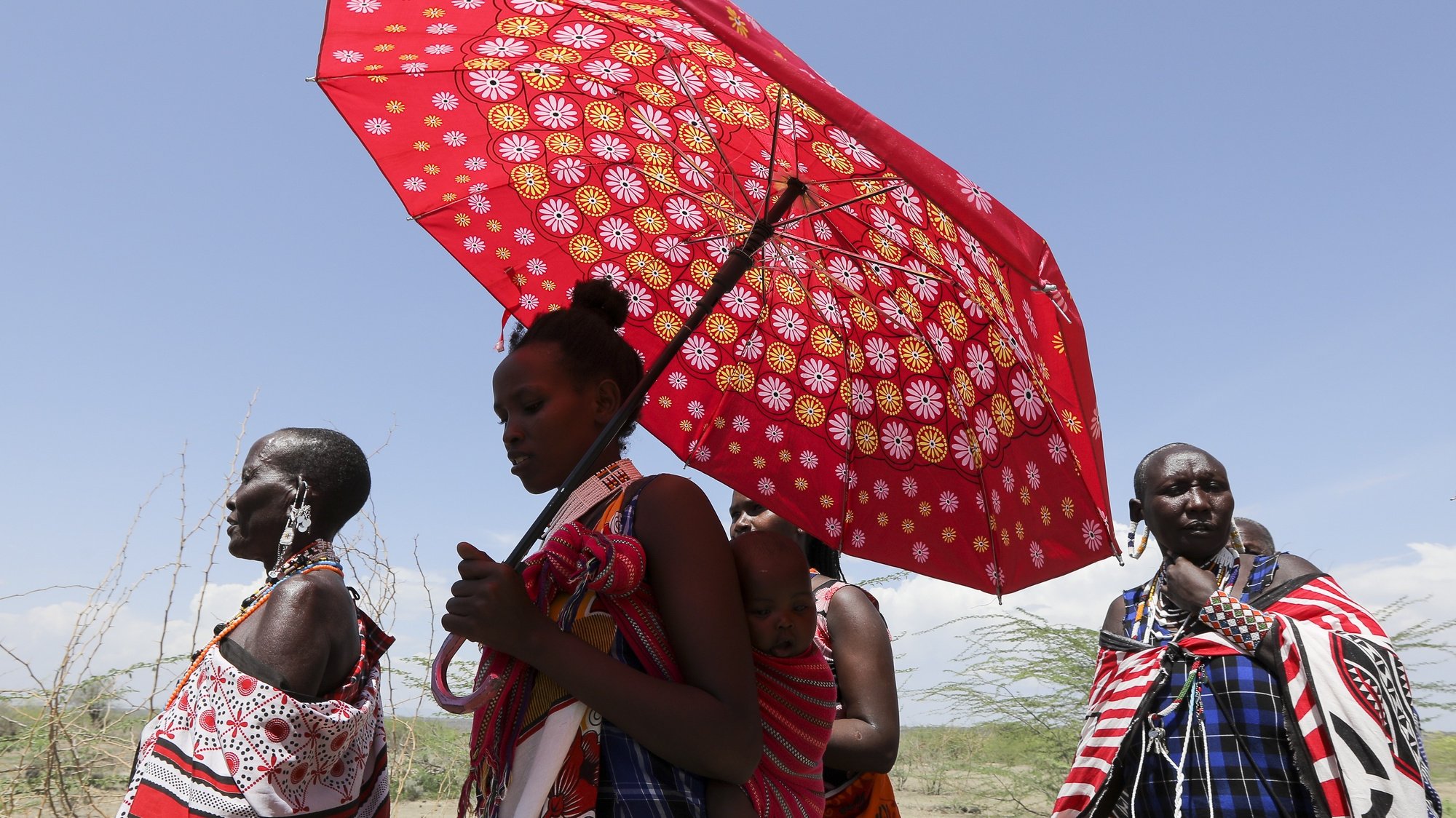 epa09849919 Kenyan women from the Maasai community take part in the Global Climate Strike in Magadi, Kajiado, Kenya, 25 March 2022. Kenyans across the country through the Fridays For Future, joined the global call to action and climate strike calling on government to make radical change in tackling climate change as millions of people around the world are taking part in protests demanding action on climate issues. The 10th global strike of Fridays for Future takes place under the motto &#039;#PeopleNotProfit.&#039;  EPA/Daniel Irungu