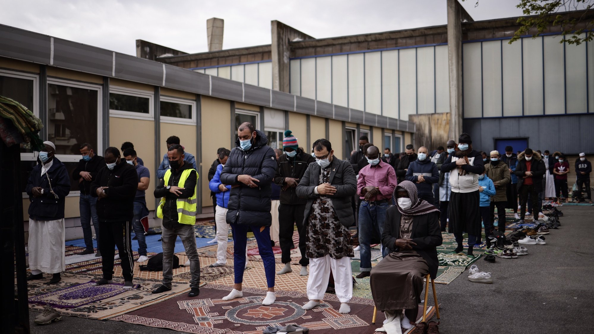 epa09124486 Muslim men preform Friday prayers on the reopening day of the Great Mosque in Pantin, near Paris, France, 09 April 2021. After six months of administrative closure for having relayed video following the terrorist attack and death of French teacher Samuel Party in Conflans-Sainte-Honorine, the Great Mosque of Pantin is now reopened to believers as Muslims around the world prepare ahead of the upcoming fasting month of Ramadan, which begins on 13 April.  EPA/YOAN VALAT