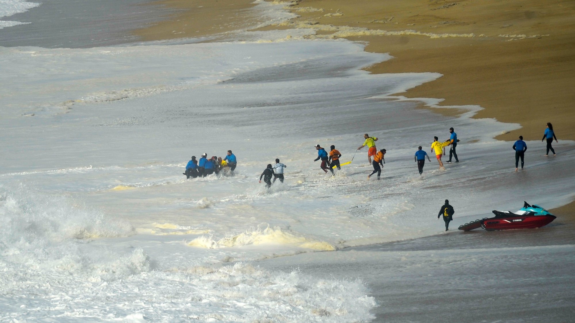 Surfers and technical team help the Portuguese surfer Alex Botelho, from the Portugal team, after his get injured during the Nazare Tour Surfing Challenge, the 5th stage of the Big Wave Tour, of the World Surf League (WSL), which takes place in Praia do Norte, Nazaré, 11th February 2020. It was almost at the end of the giant wave championship that started this morning in the Nazare &#039;cannon&#039; that the accident occurred, with the jet ski on which Alex Botelho was being caught by a huge wave and the surfer becoming unconscious for about two minutes, when he was rescued. CARLOS BARROSO/LUSA