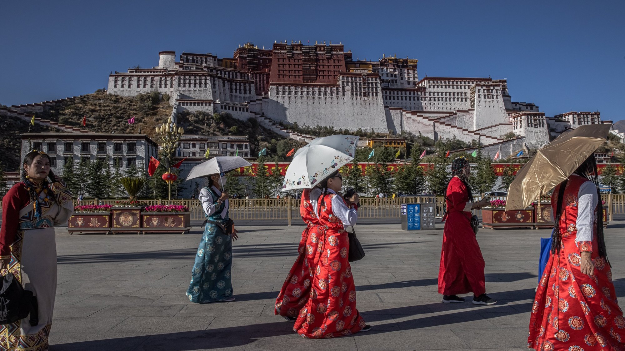 epa08751193 Women visit the square in front of the Potala Palace in Lhasa, Tibet Autonomous Region, China, 15 October 2020 (issued 16 October 2020). The visit to Tibet for journalists is a government-organised media tour focused on a poverty alleviation program. Tibet is considered one of China&#039;s poverty-stricken areas. The Chinese government plans to eradicate extreme poverty by the end of 2020. The famous Potala Palace used to be the main residence of the Dalai Lama but is now preserved as a museum and world heritage site.  EPA/ROMAN PILIPEY