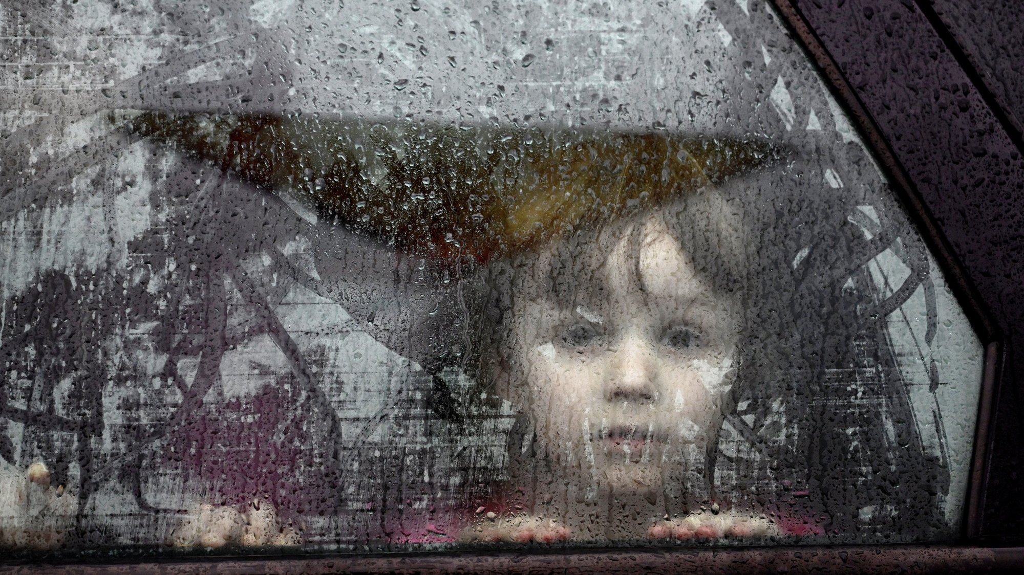 epa09880407 A refugee child from Ukraine upon arrival at the Humanitarian Aid Center in Przemysl, Poland 09 April 2022. Today marks 45 days of Russian aggression against Ukraine.  EPA/Darek Delmanowicz POLAND OUT