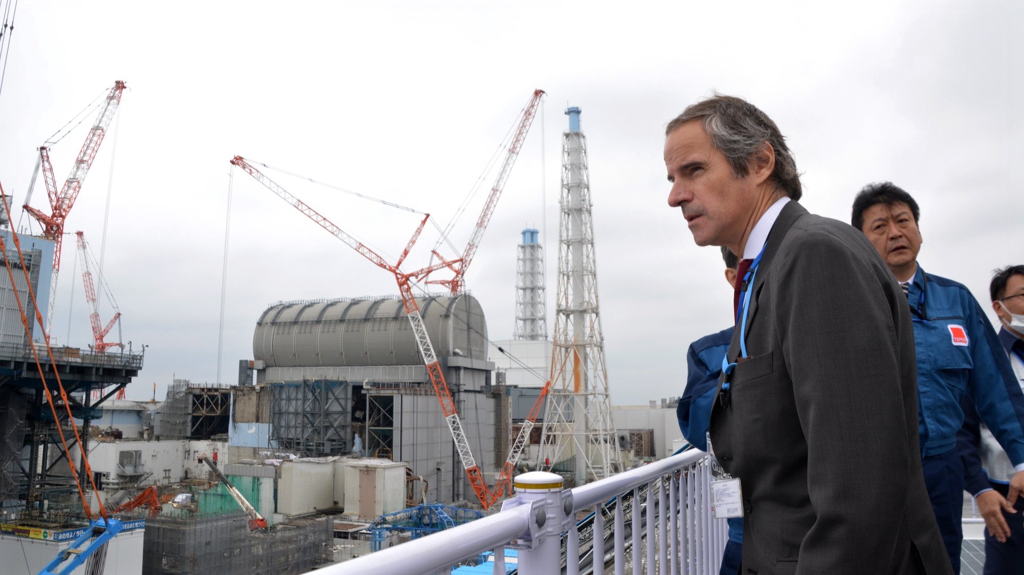 epa08249362 IAEA Director General Rafael Grossi (R) inspects tsunami-devastated Tokyo Electric Power Company&#039;s Fukushima Daiichi Nuclear Power Plant under demolition work in Okuma, Fukushima Prefecture, northern Japan, 26 February 2020. Reactor houses destroyed by tsunami in March 2011 are seen on the left.  EPA/JIJI PRESS JAPAN OUT EDITORIAL USE ONLY/  NO ARCHIVES