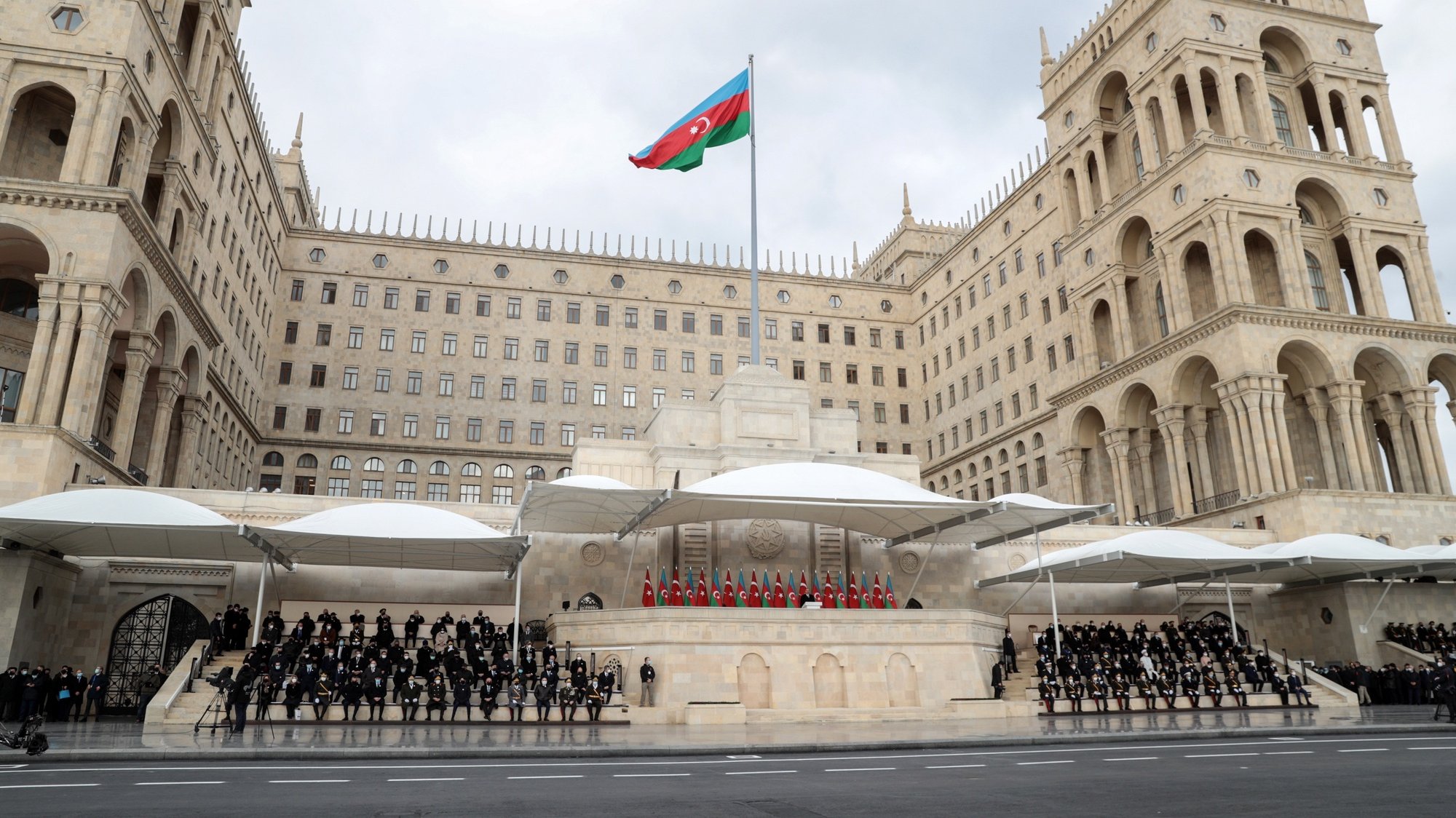 epa08874747 Azerbaijani President Ilham Aliyev (C) attends a military parade dedicated to the victory in the Nagorno-Karabakh armed conflict, in Baku, Azerbaijan, 10 December 2020. The simmering territorial conflict between Azerbaijan and Armenia over Nagorno-Karabakh territory erupted into a war between the two countries on 27 September 2020 along the contact line of the self-proclaimed Nagorno-Karabakh Republic (also known as Artsakh). On 09 November 2020 Presidents of Azerbaijan and Russia and Armenian Prime Minister signed a joint statement announcing a complete ceasefire and halt of all military operations in the Nagorno-Karabakh conflict zone, and return of the Aghdam, Kalbajar and Lachin districts to Azerbaijan.  EPA/POMAN ISMAYILOV