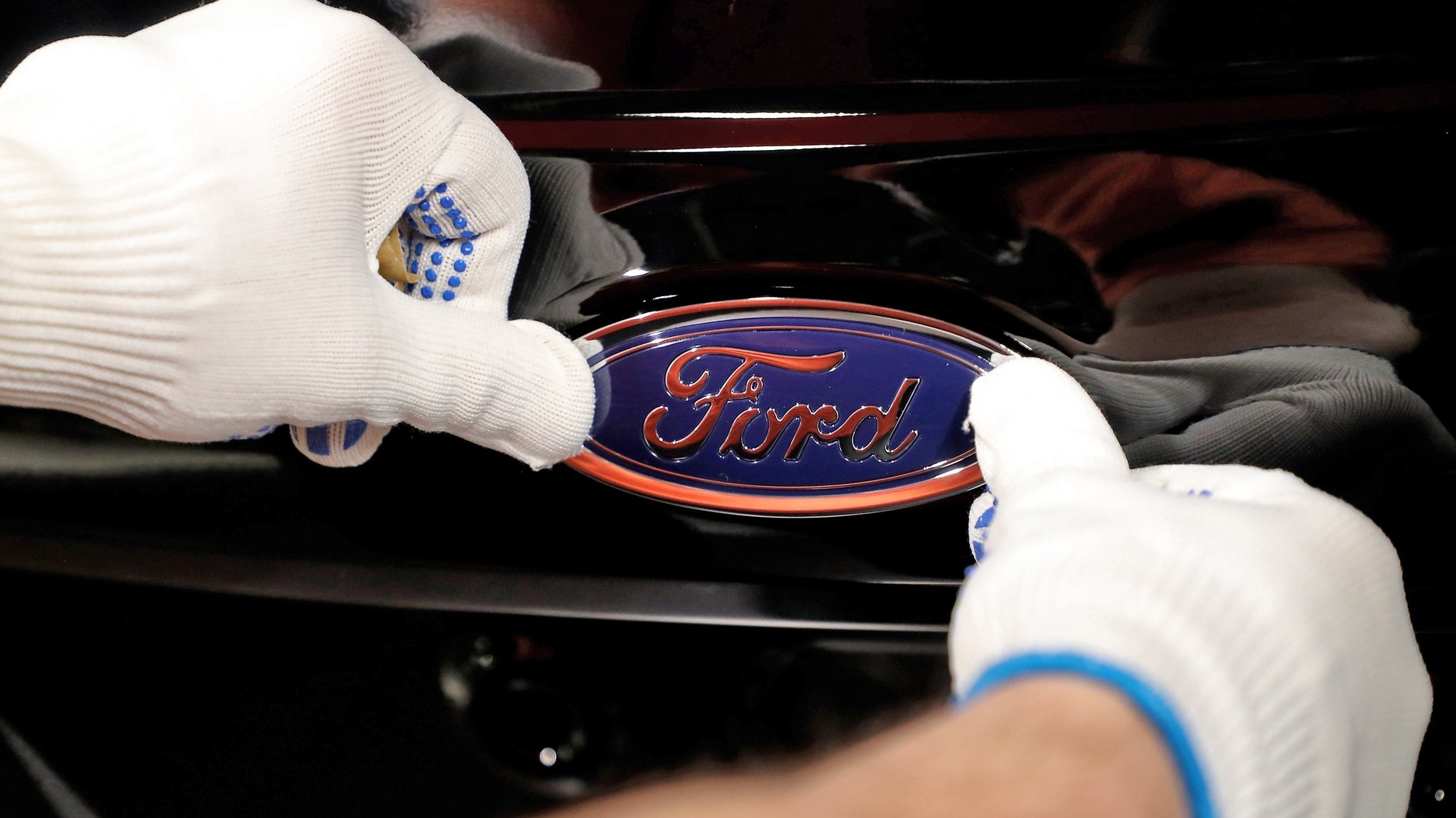 epa07314696 (FILE) - A worker attaches the Ford logo to a Fiesta car at the US car manufacturer plant Ford in Cologne, Germany, 18 January 2019 (reissued 24 January 2019). Ford on 23 January 2019 said their 4th quarter 2018 earnings missed estimates of analysts, with the company being profitable in USA but losing in other markets. Ford reported a loss 116 million USD for the 4th quarter 2018, compared with 2.5 billion USD net profit in 4th quarter 2017 and said it would reduce its workforce in Europe by thousands of employees in a bid to become profitable  again.  EPA/FRIEDEMANN VOGEL