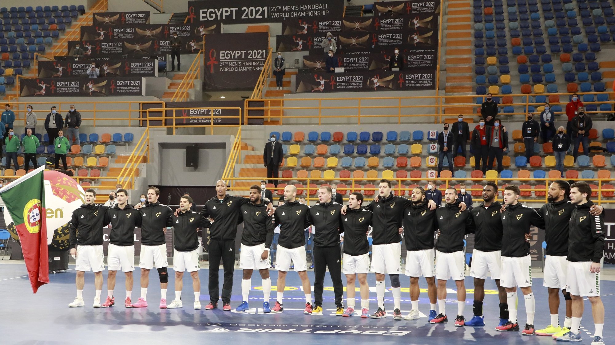 epa08946613 Portugal players line up prior to the match between Portugal and Algeria at the 27th Men&#039;s Handball World Championship in Cairo, Egypt, 18 January 2021.  EPA/Khaled Elfiqi / POOL