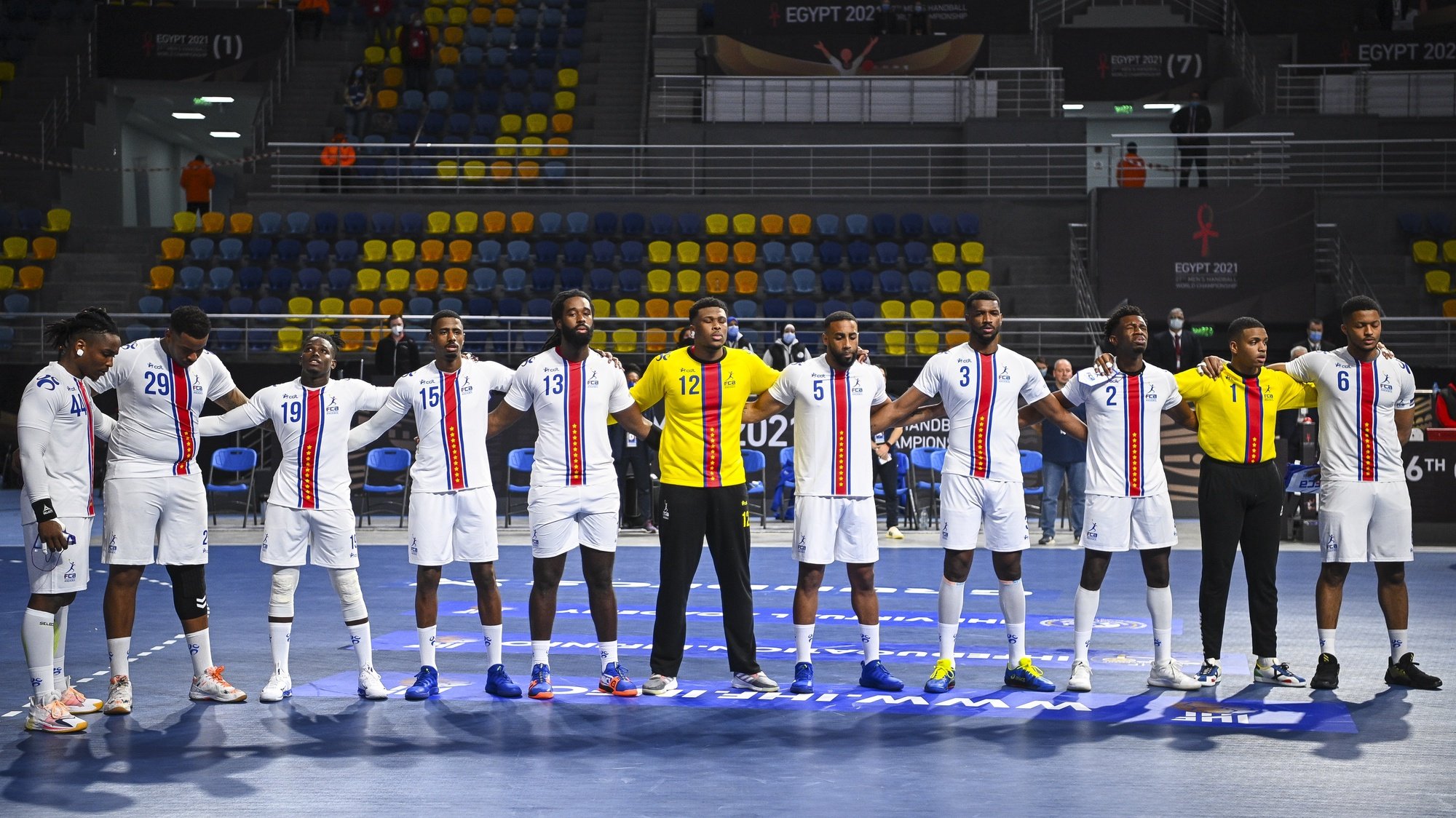 epa08940146 Players of the Cape Verde team line up prior to the match between Hungary and Cape Verde at the 27th Men&#039;s Handball World Championship in Cairo, Egypt, 15 January 2021.  EPA/Anne-Christine Poujoulat / POOL