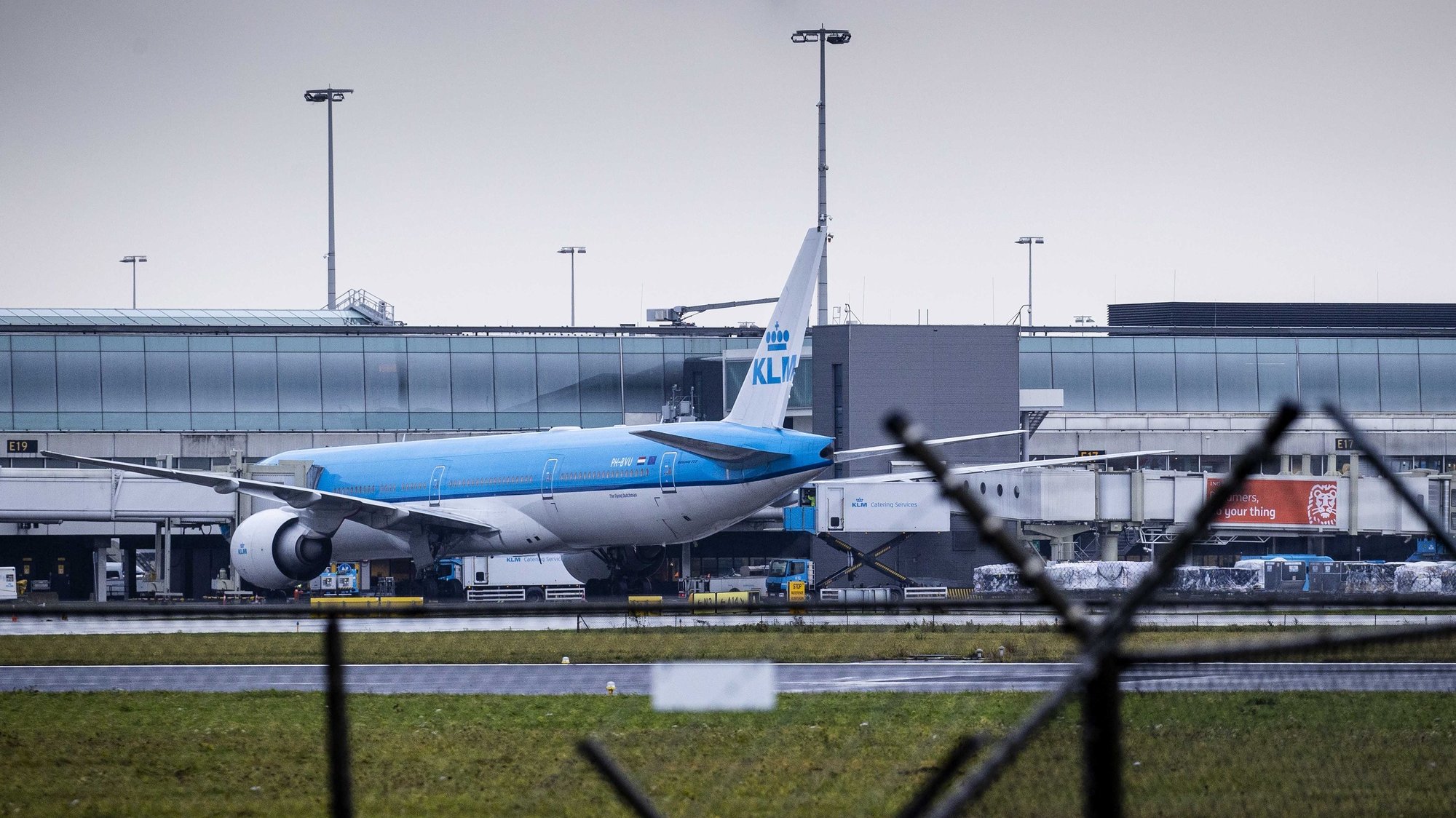 epa09607511 A KLM plane is seen at gate E19 after arriving from Johannesburg, at Pier E at Schiphol Airport, The Netherlands, 27 November 2021. Schiphol Airport authorities said the airport is not taking additional measures after 61 passengers who arrived on two flights from South Africa a day earlier were tested positive for coronavirus. Two planes arrived from Johannesburg and Cape Town just as the Dutch government along other countries banned all travels from and to South Africa due to concerns over of a newly detected and highly mutated Covid-19 variant, B.1.1.529.  EPA/SEM VAN DER WAL