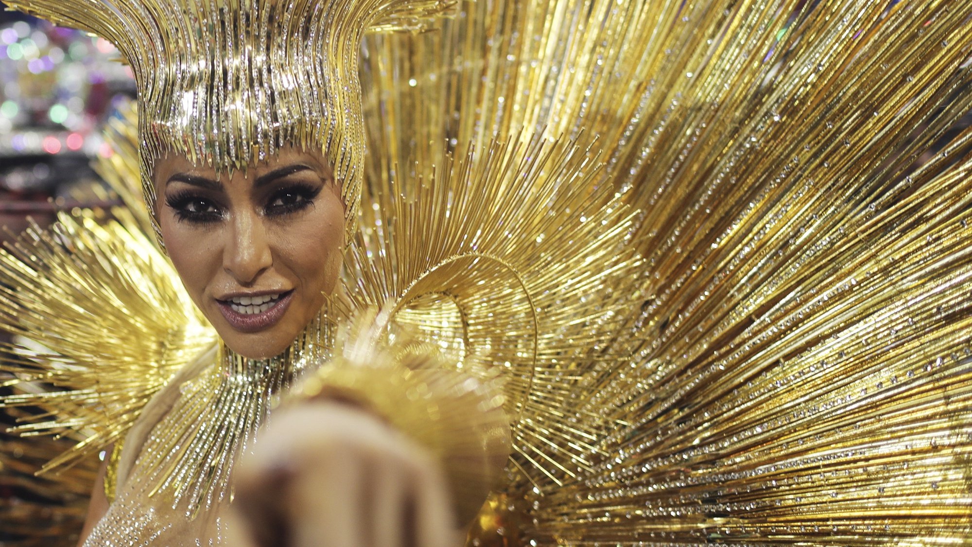 epa08446655 A dancer of the samba school Grupo Especial Vila Isabel is dressed in gold as she takes part in the carnival celebration in Rio de Janeiro, Brazil, 11 February 2018 (reissued 27 May 2020). Gold is considered a majestic color that symbolizes wealth and luxury. It is associated with success, achievement, and triumph, but it can also be deemed decadent and overindulgent. Connected with prestige and elegance, gold symbolizes divinity, power, and wisdom in many religions due to its association with masculine energy and the power of the sun.  EPA/ANTONIO LACERDA  ATTENTION: This Image is part of a PHOTO SET *** Local Caption *** 54107662