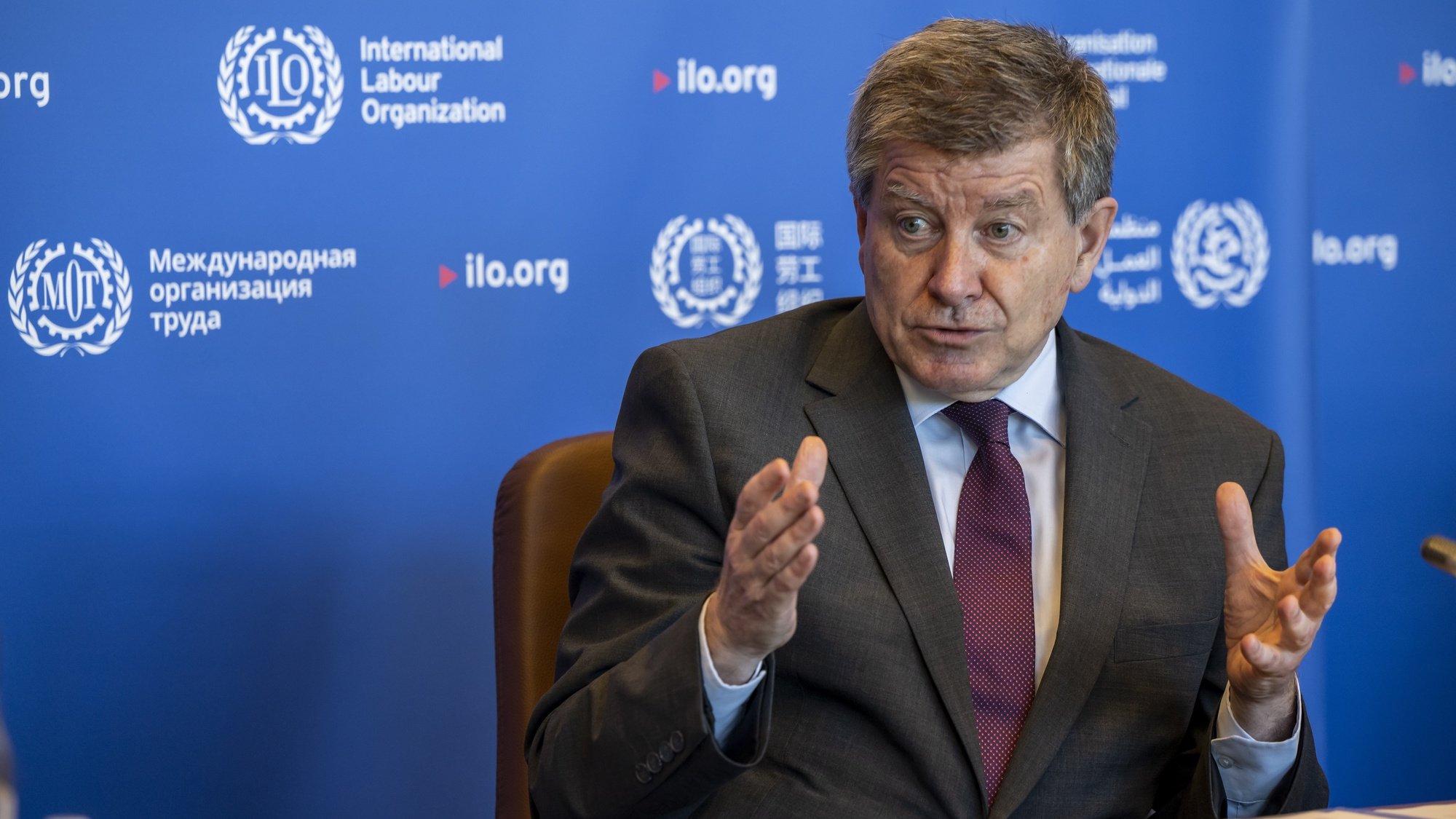epa09974956 General Director of the International Labour Organisation, ILO, Guy Ryder speaks during meetings and discussions with Minister of Labor and Social Economy of Spain Yolanda Diaz at the headquarters of the Intermational Labour Organisation, (OIT ILO BIT), in Geneva, Switzerland, 25 May 2022. The meetings were about two subjects inclusion of lesbian, gay, bisexual, transgender, intersex and queer (LGBTIQ+) persons in the World of Work, lauch of a learning guide and Ceremony, deposit of the instruments of ratification of conventions (home work convention, 1996) and Violence and harassment convention, 2019 by the Government of Spain.  EPA/MARTIAL TREZZINI