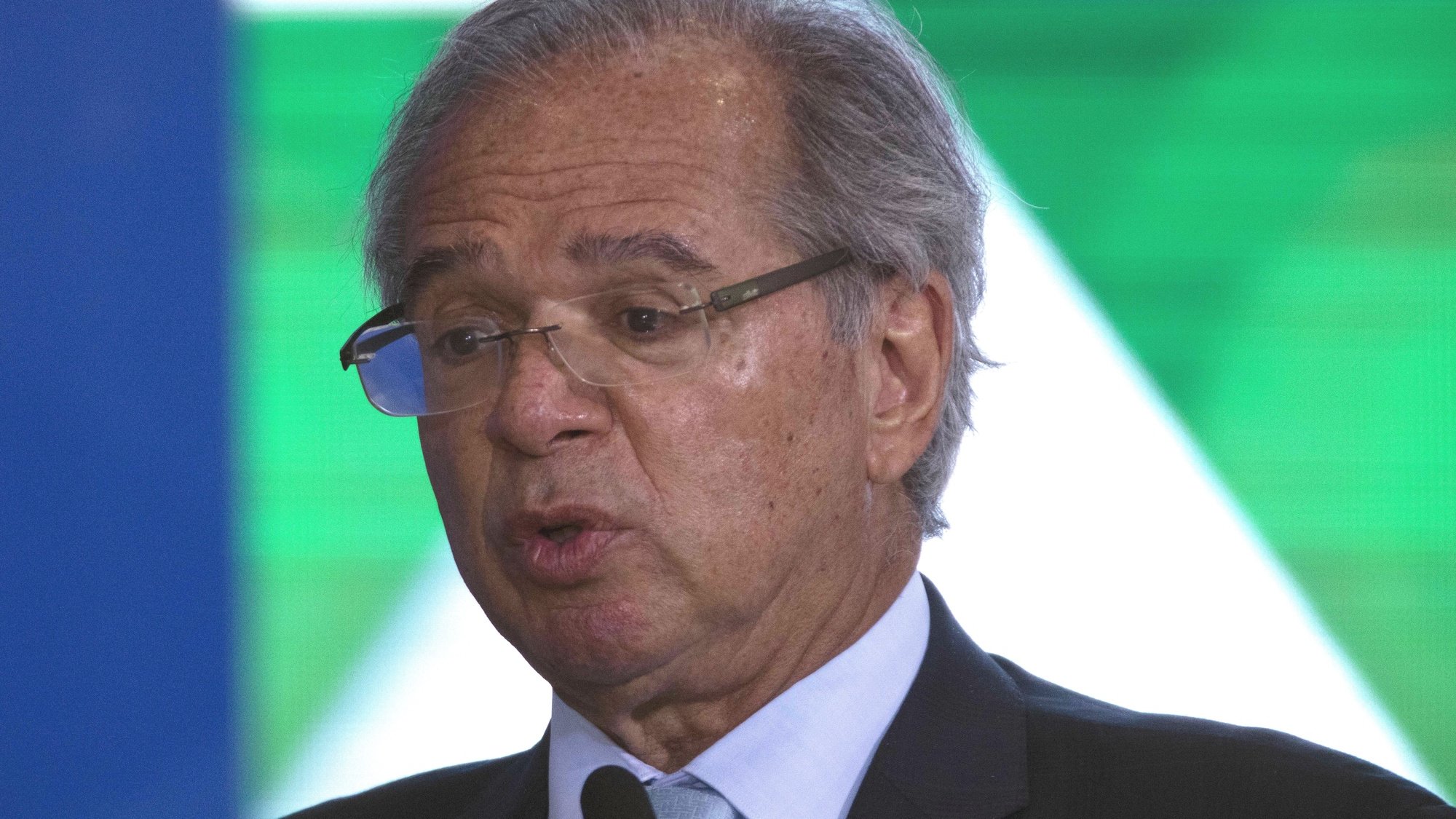 epa10037569 The Minister of the Economy, Paulo Guedes, participates during the presentation of new national identity documents, including the new Brazilian passport in the Palace do Planalto of Brasilia, Brazil, 27 June 2022.  EPA/Joedson Alves