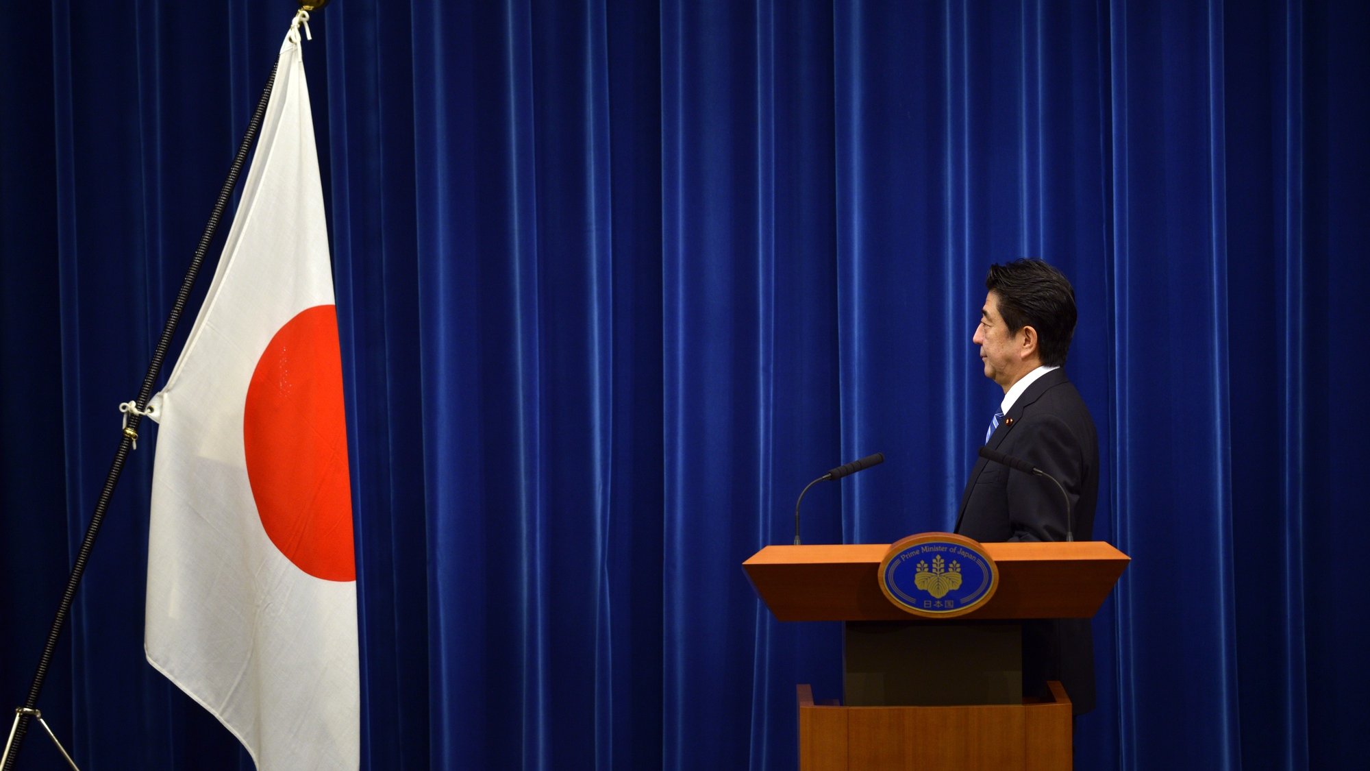 epa10058761 (FILE) - Japanese Prime Minister Shinzo Abe poses facing towards the national flag at the Prime Minister&#039;s official residence in Tokyo, Japan, 01 October 2013 (reissued 08 July 2022). According to Japan&#039;s national broadcaster, former Prime Minister Shinzo Abe died of his injuries on 08 July 2022, hours after being shot during an Upper House election campaign act to support a party candidate, outside a railway station in Nara, western Japan. He was 67. Abe had served as Japan&#039;s prime minister from 2006 to 2007 and again from 2012 to 2020. He was the longest-serving prime minister in the history of the country.  EPA/FRANCK ROBICHON *** Local Caption *** 56302707