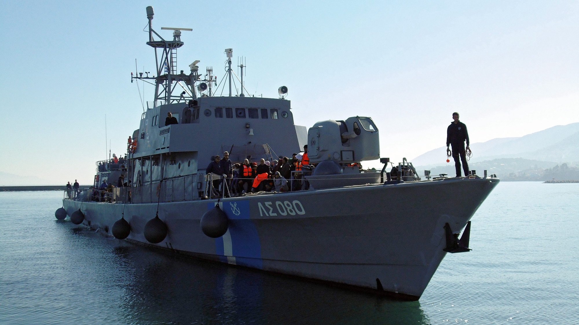 epa05140064 Migrants and refugees arrive ON a coastguard boat in Mytilini, Lesvos Island, Greece, 02 February 2016, The Lesvos coast guard patrol boat &#039;PATH 80 - Agios Efstratios&#039; on 02 February 2016, rescued 413 migrants and refugees found floating adrift in the sea between the island and the Turkish coast - breaking the record for the number brought to safety in a single rescue operation. 2,000 refugees and migrants to the eastern shores of Lesvos, with the coast guard and Frontex called to rescue 1,000 from boats.  EPA/STRATIS BALASKAS