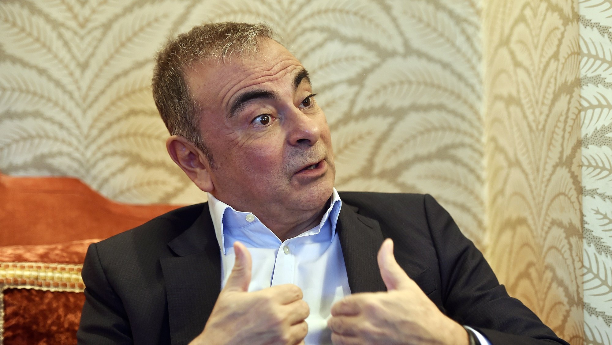 epa08891505 Lebanese-French businessman Carlos Ghosn speaks during an interview in Beirut, Lebanon, 16 December 2020 (issued 18 December 2020). Former Nissan chairman Carlos Ghosn on 29 December 2019 fled from Japan where he was on bail and under surveillance in Tokyo awaiting trial on financial misconduct charges.  EPA/WAEL HAMZEH
