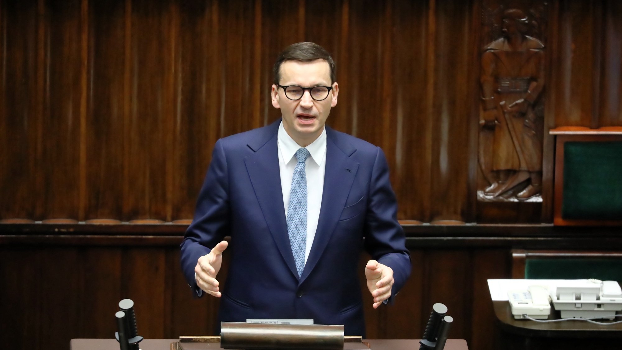 epa09646452 Polish Prime Minister Mateusz Morawiecki speaks during a parliamentary debate on the Polish budget 2022 in the Sejm (lower house) in Warsaw, Poland, 17 Deccember 2021.  EPA/Tomasz Gzell POLAND OUT