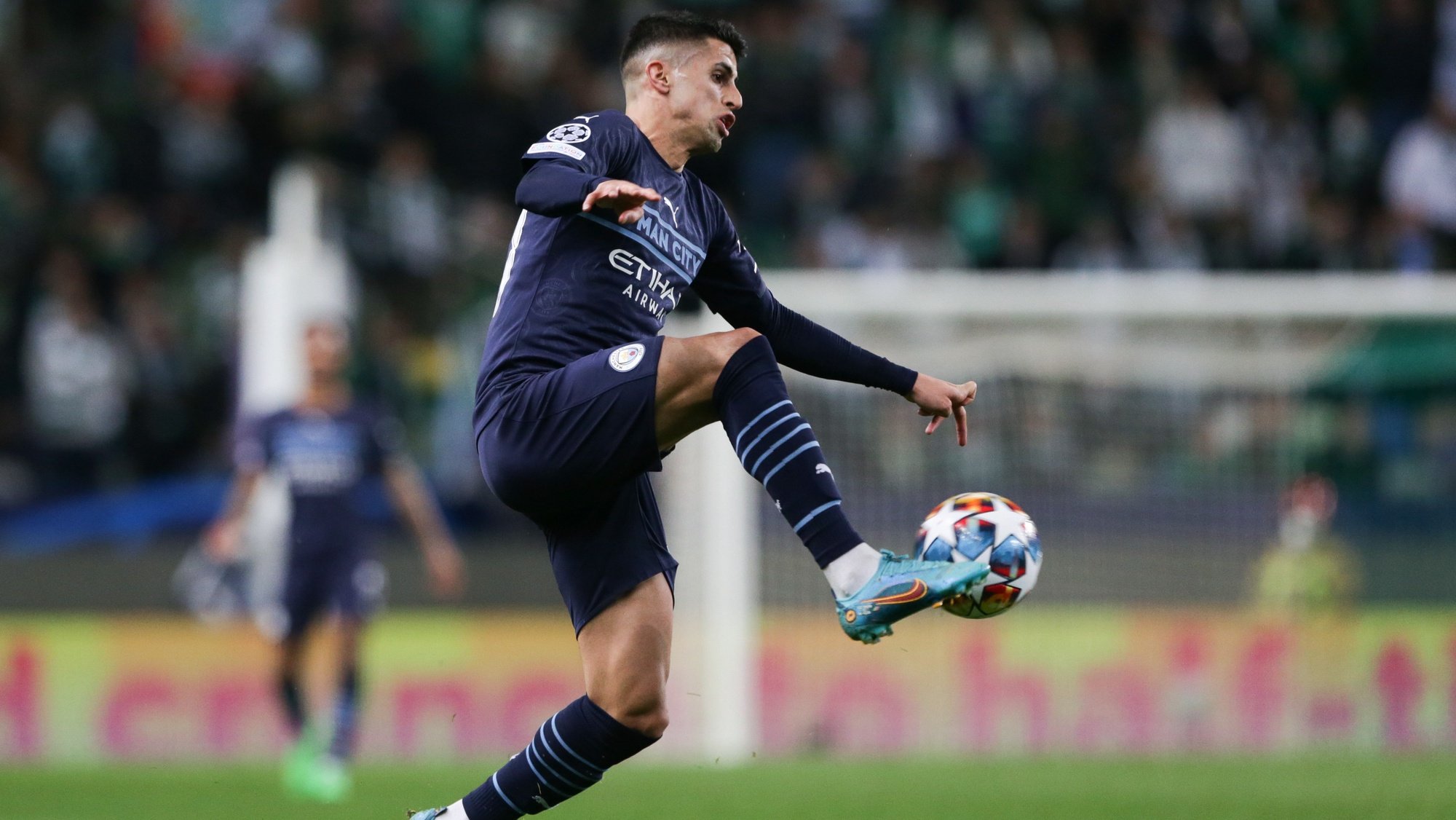 Manchester City player Joao Cancelo in action during their UEFA Champions League quarter finals first leg soccer match against Sporting at Alvalade Stadium in Lisbon, Portugal, 15 de February 2022. TIAGO PETINGA/LUSA