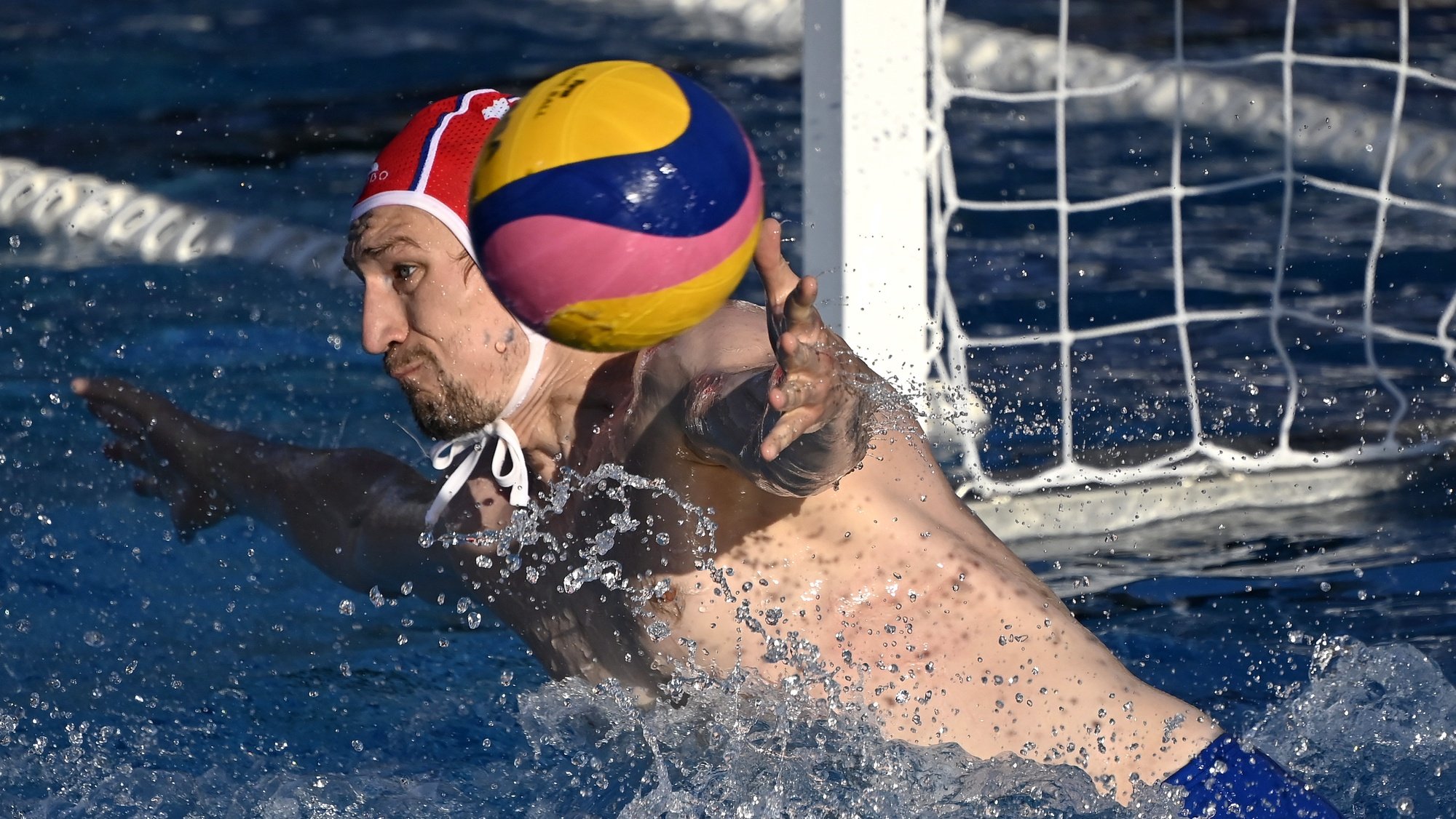 epa09321170 Russia&#039;s goalkeeper Igor Chirkov (L) fails to save during the men&#039;s water polo BENU Cup first round match Russia vs. Spain in Budapest, Hungary, 03 July 2021.  EPA/Tamas Kovacs HUNGARY OUT HANDOUT NO ARCHIVES