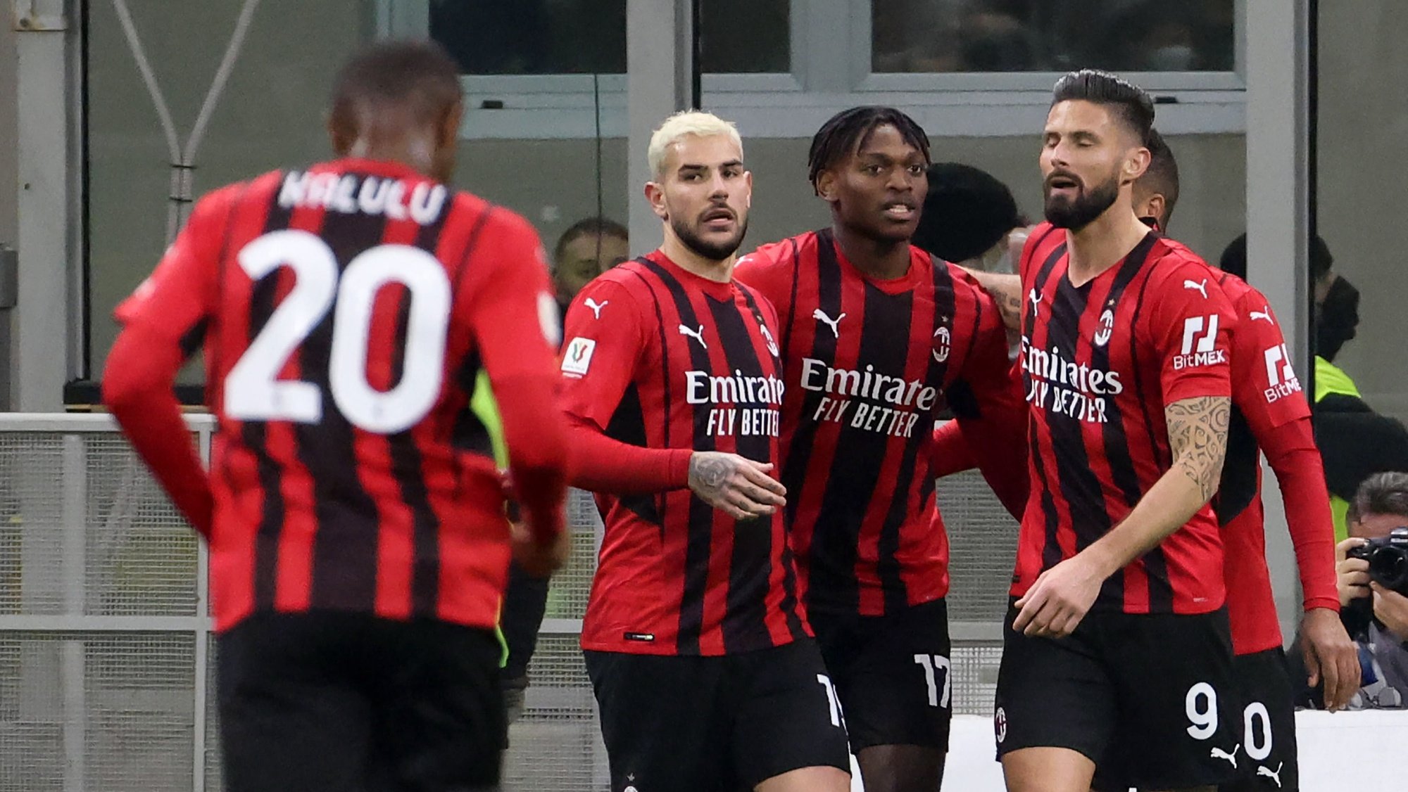 epa09741902 AC Milanâ€™s Rafael Leao (2-R) celebrates with his teammates after scoring  the opening goal during the Italian Cup quarterfinal soccer match between AC Milan and SS Lazio at Giuseppe Meazza stadium in Milan, Italy, 09 February 2022.  EPA/MATTEO BAZZI