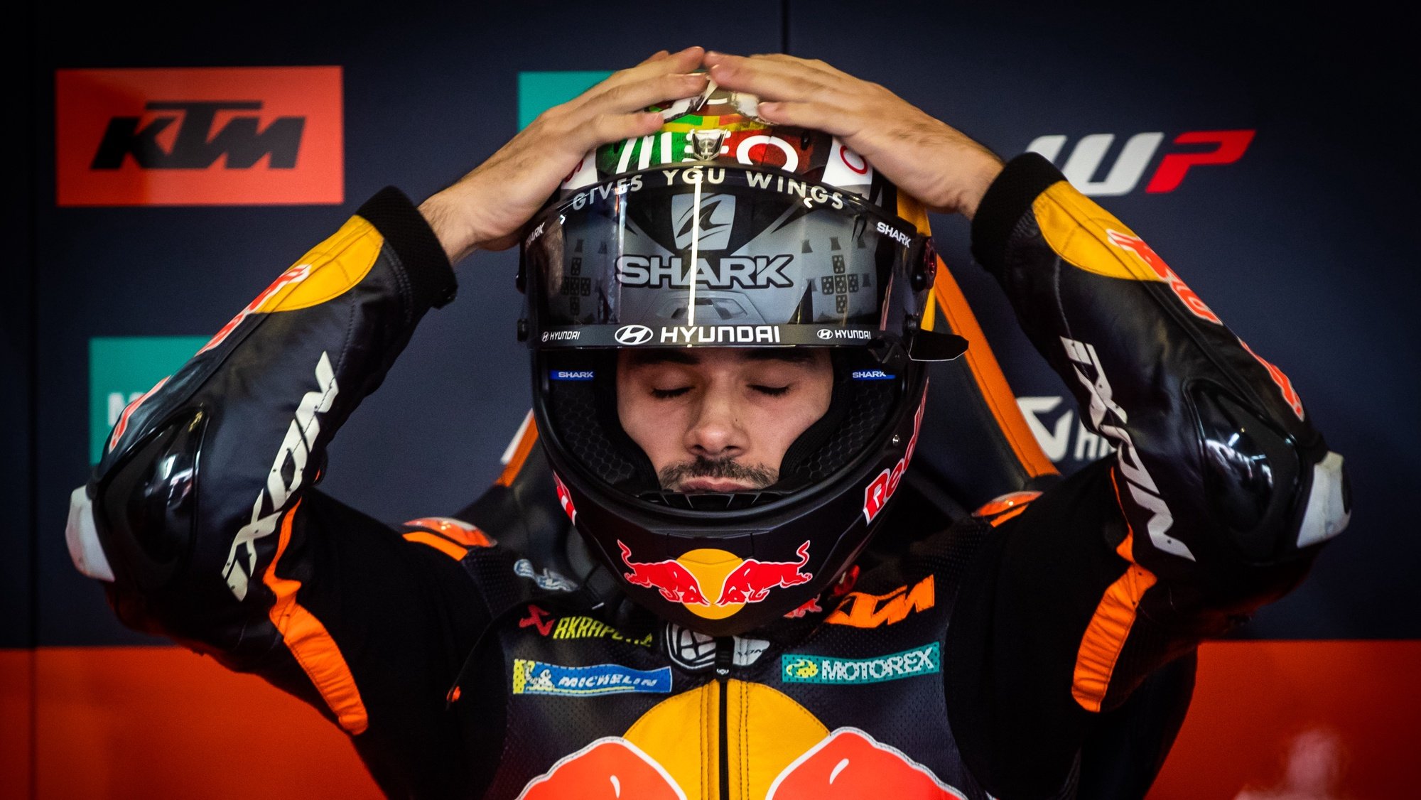 Portuguese rider Miguel Oliveira of Red Bull KTM Factory Racing team puts on his helmet prior to the third practice session for the Grand Prix of Portugal at the Algarve International race track, south of Portugal, 23 April 2022. JOSE SENA GOULAO/LUSA