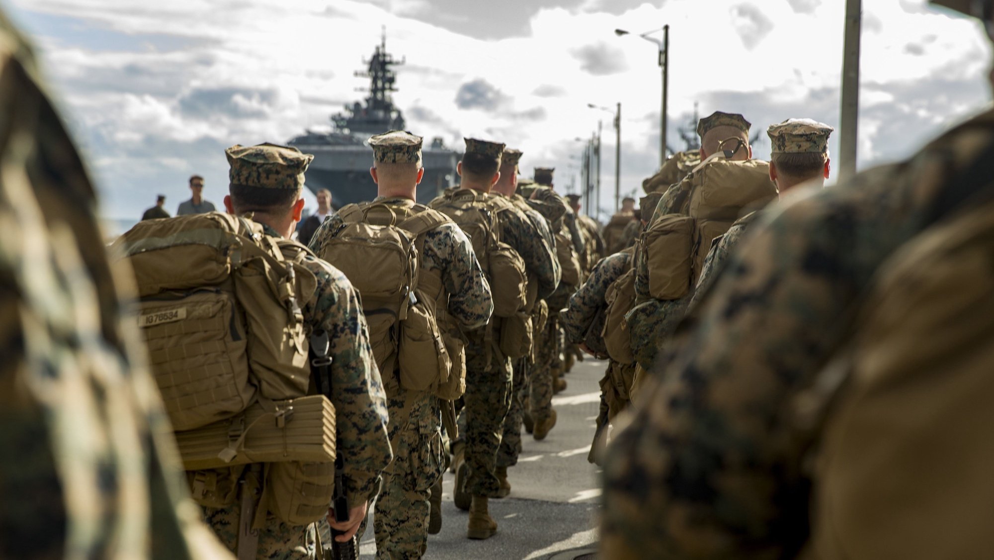 epa06519826 A handout photo made available by the US Marine Corps shows Marines with Headquarters and Service Company, 3rd Battalion, 3rd Marine Regiment, 3rd Marine Division, march on the pier towards the amphibious assault ship USS Bonhomme Richard (LHD-6) in Okinawa, Japan, 01 February 2018 (issued 13 February 2018). The Marines are preparing to embark on the USS Bonhomme Richard going to Thailand to participate in Exercise Cobra Gold 2018. Cobra Gold 18 is an annual exercise conducted in the Kingdom of Thailand and runs from 13 to 23 February, with seven full participating nations.  EPA/SGT. RICKY GOMEZ / HANDOUT  HANDOUT EDITORIAL USE ONLY/NO SALES