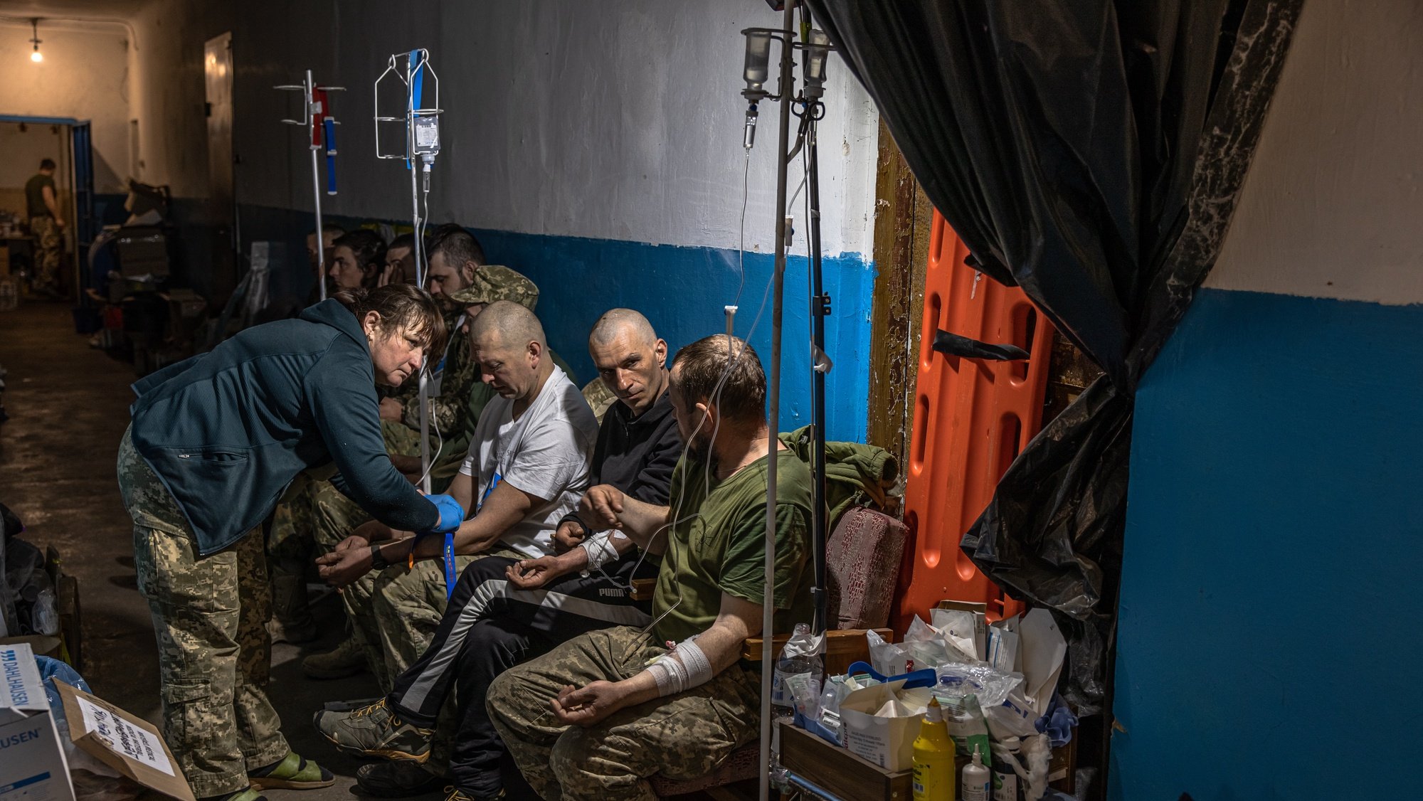 epa09938846 Ukrainian soldiers with minor injuries are treated at a frontline field hospital near Popasna, Luhansk region, eastern Ukraine, 10 May 2022. On 24 February, Russian troops invaded Ukrainian territory starting a conflict that has provoked destruction and a humanitarian crisis. According to the UNHCR on 09 May, about 5.9 million Ukrainians have left the country to seek refuge abroad.  EPA/ROMAN PILIPEY