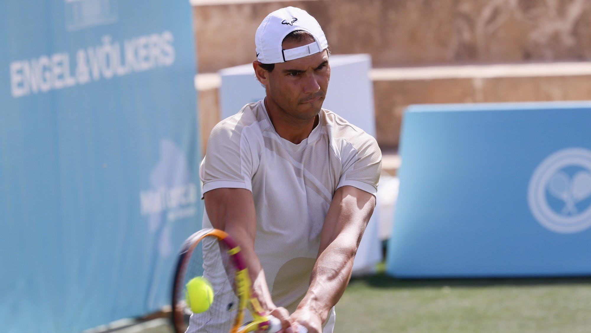 epa10017874 Spanish tennis player Rafael Nadal in action during a training session at the Mallorca Country Club, venue of the ATP250 Mallorca Championships in Santa PonÃ§a, Spain, 17 June 2022. The tournament will run from June 18 to 25.  EPA/CATI CLADERA