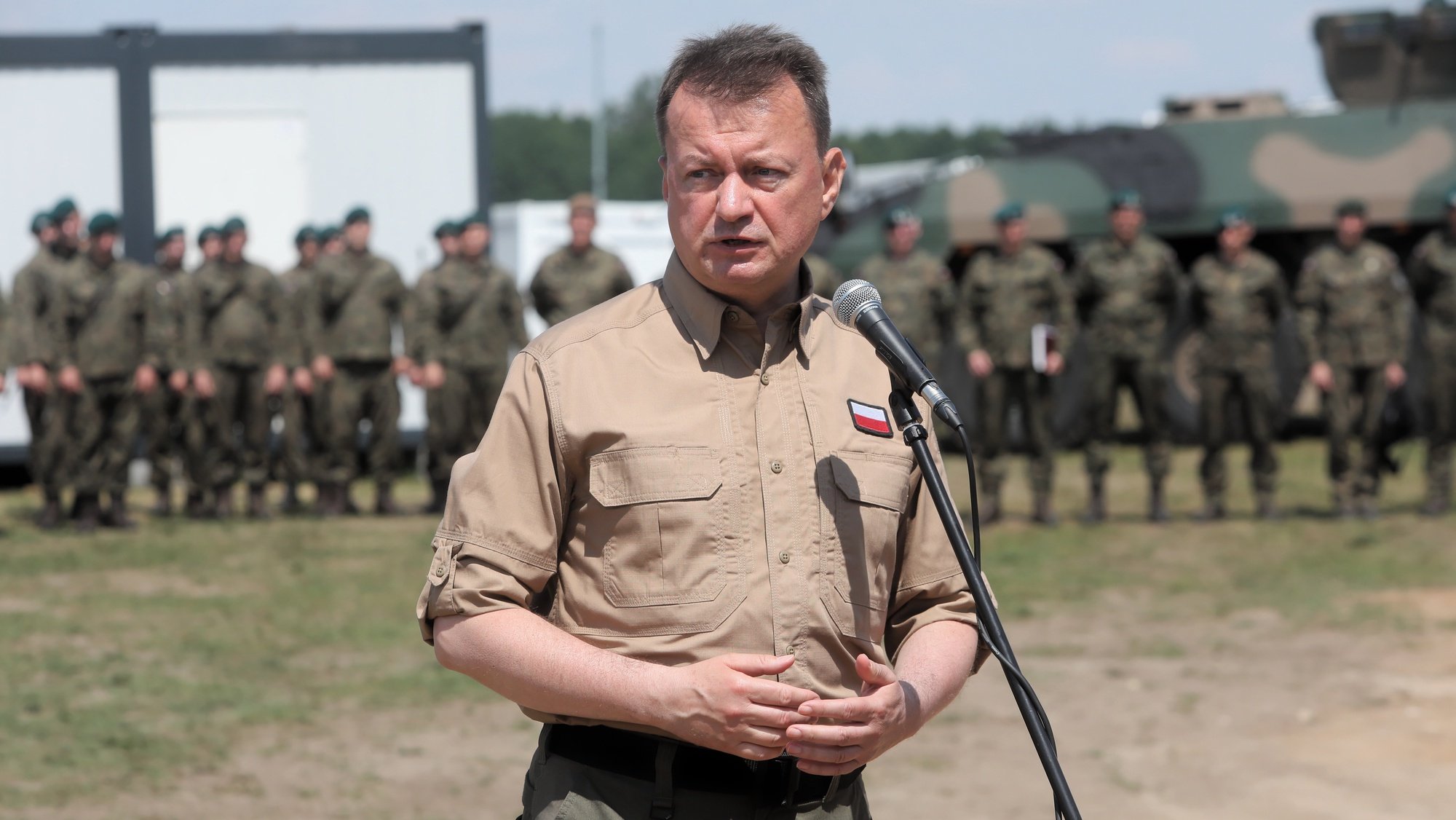 epa10036773 Deputy Prime Minister, Minister of National Defence Mariusz Blaszczak speaking to the media after a briefing on the situation on the Polish-Belarusian border, at a military encampment in the town of Nowa Luka, eastern Poland, 27 June 2022. Poland dealt with illegal imigration of Belarus, but Border security is especially following Russia&#039;s military invasion in Ukraine.  EPA/Artur Reszko POLAND OUT