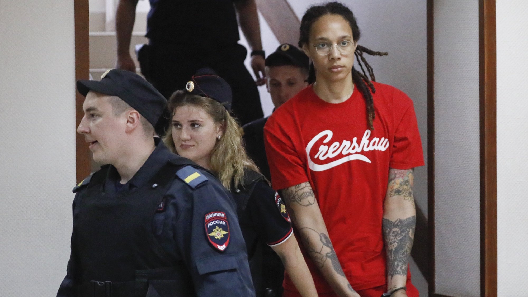 epa10056821 Two-time Olympic gold medalist and WNBA&#039;s Phoenix Mercury Brittney Griner (R) is escorted to a courtroom for a hearing, in Khimki City Court, outside Moscow, Russia, 07 July 2022. The Khimki City Court reportedly had extended Griner&#039;s detention for the duration of her trial on charges of drug smuggling that started on 01 July. Griner was arrested in February at Moscow&#039;s Sheremetyevo Airport after some hash oil was detected and found in her luggage, for which she now could face a prison sentence of up to ten years.  EPA/YURI KOCHETKOV