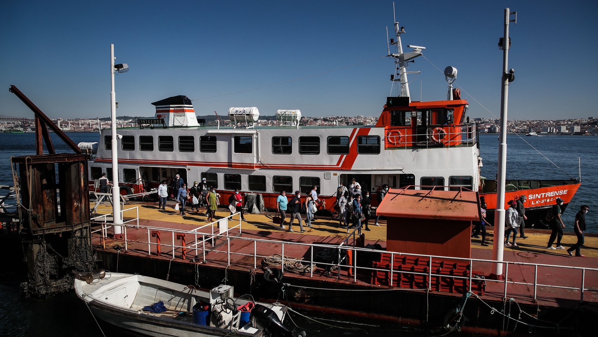 People disembark from a ferryboat &#039;cacilheiro&#039; coming from Lisbon at Cacilhas station, Almada, Portugal, 20 May 2020. Public transportation has been strengthened with the entry of the second phase of deconfinement due to the covid-19 pandemic, despite this, careers are still short, which contrasts with the large use of river transport by Transtejo/Soflusa. MARIO CRUZ/LUSA
