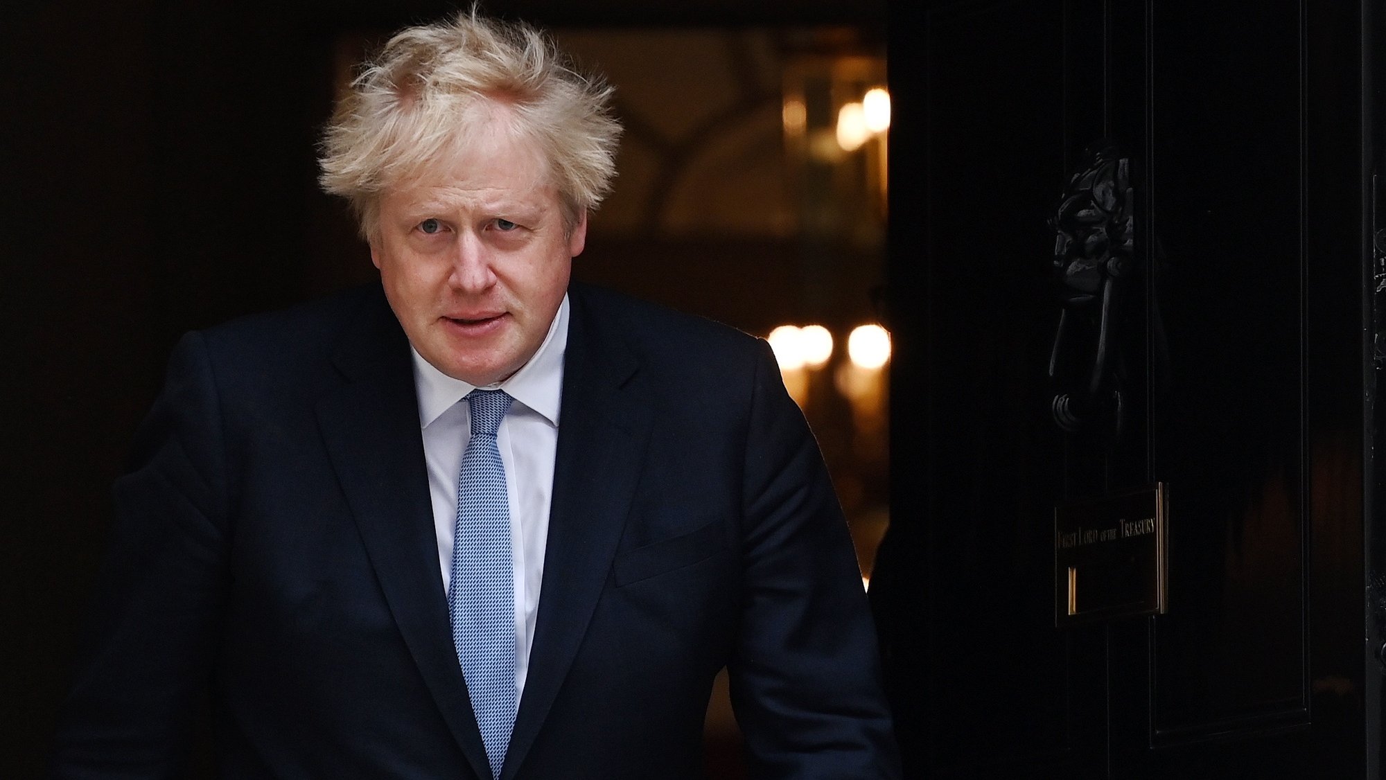 epa09944193 British Prime Minister Boris Johnson exits 10 Downing Street to greet Prime Minister of Norway Jonas Gahr Store in London, Britain, 13 May 2022.  EPA/ANDY RAIN