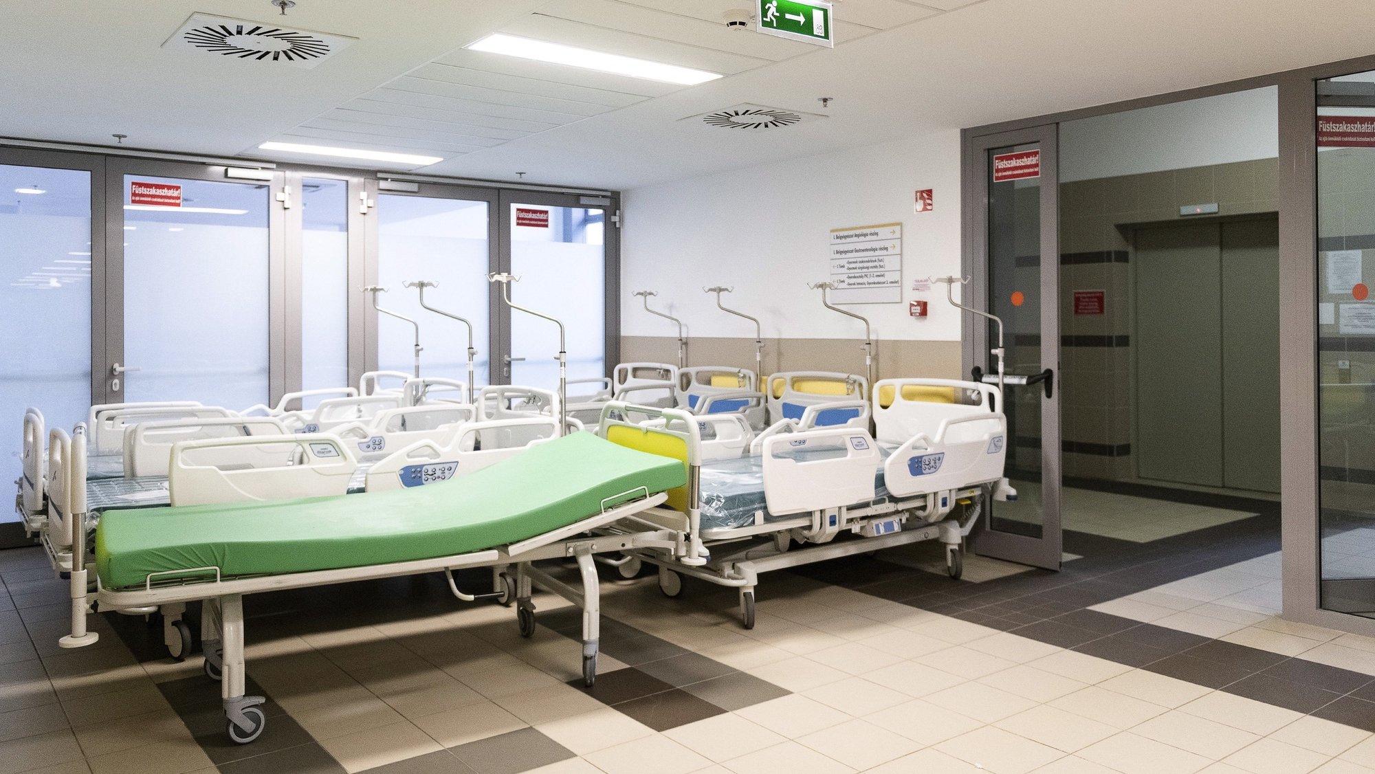 epa09113595 Hospital beds stored on the corridor for emergency use at the intensive care unit of the Andras Josa Training Hospital during the coronavirus pandemic in Nyiregyhaza, Hungary, 02 March 2021 (issued 03 March 2021).  EPA/Attila Balazs HUNGARY OUT