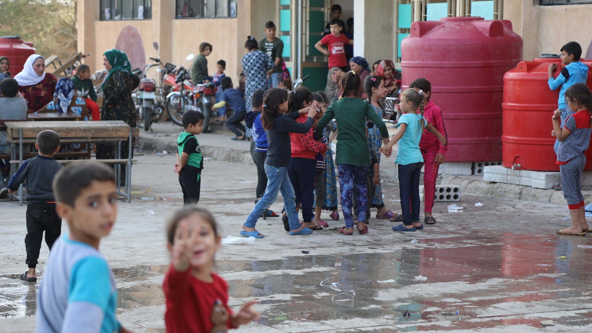 epa07920763 Displaced Kurdish children who fled their home town of Ras al-Ain city play at temporary shelter in a school building at Tal Tamr town, northeast of Syria, 14 October 2019. Turkey has launched an offensive targeting Kurdish forces in north-eastern Syria, days after the US withdrew troops from the area.  EPA/STR
