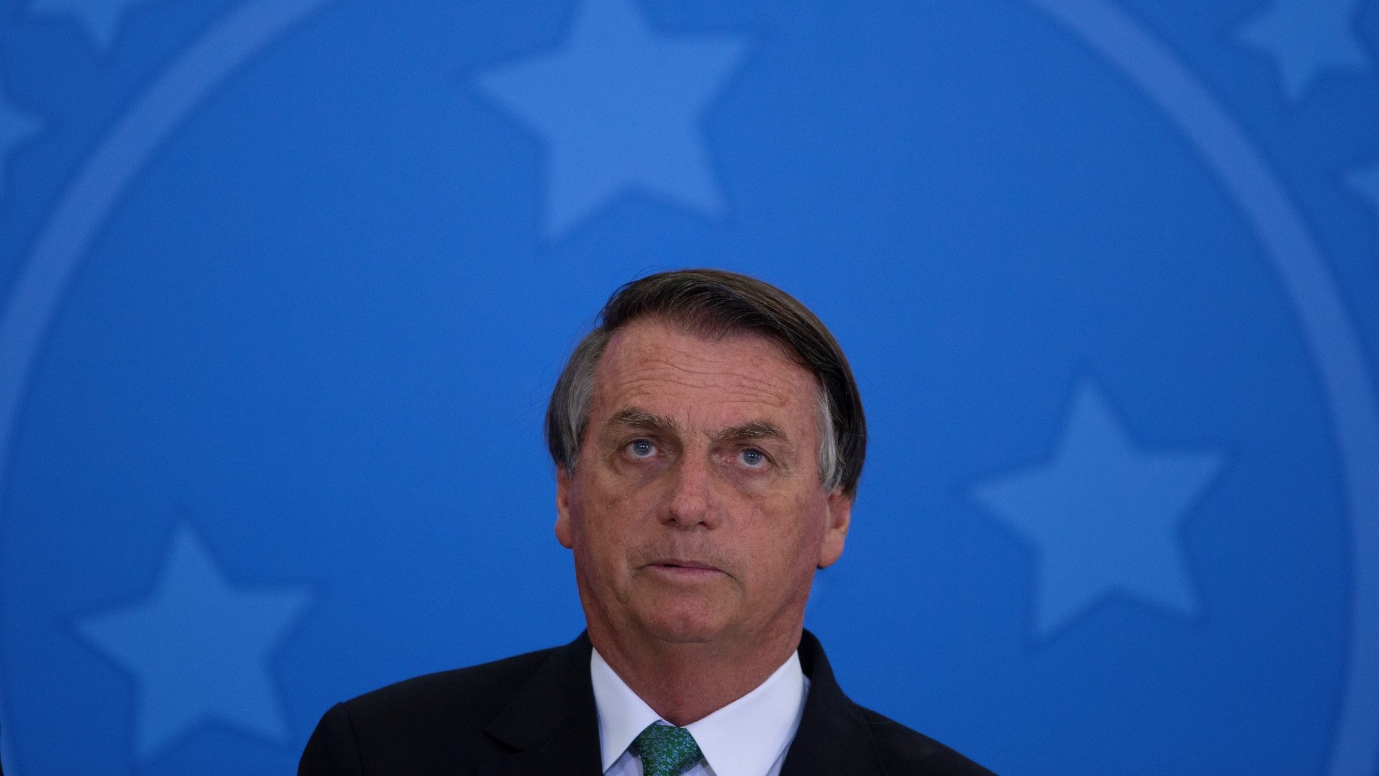 epa09641639 Brazilian President Jair Bolsonaro speaks during the launch of the Rodovida Program at the Planalto Palace, in Brasilia, Brazil, 14 December 2021. The Federal Police confirmed that it will summon the Brazilian President, Jair Bolsonaro, to testify in a process in which he is being investigated for a campaign he maintained against the electronic ballot boxes used in elections in the country.  EPA/Joedson Alves