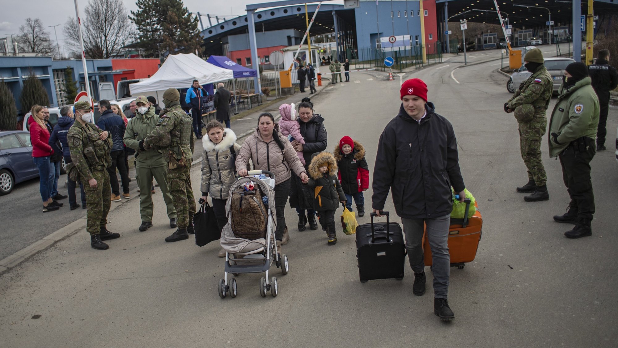 epa09786723 People fleeing Ukraine arrive to Slovakia, at border crossing in Vysne Nemecke, Slovakia, 26 February 2022. Slovakia said it will let fleeing Ukrainians into the country following Russia&#039;s military operation in Ukraine. The Slovak Police Force announced on social media that people not holding a valid travel document will also be eligible for entry on an individual basis.  EPA/MARTIN DIVISEK