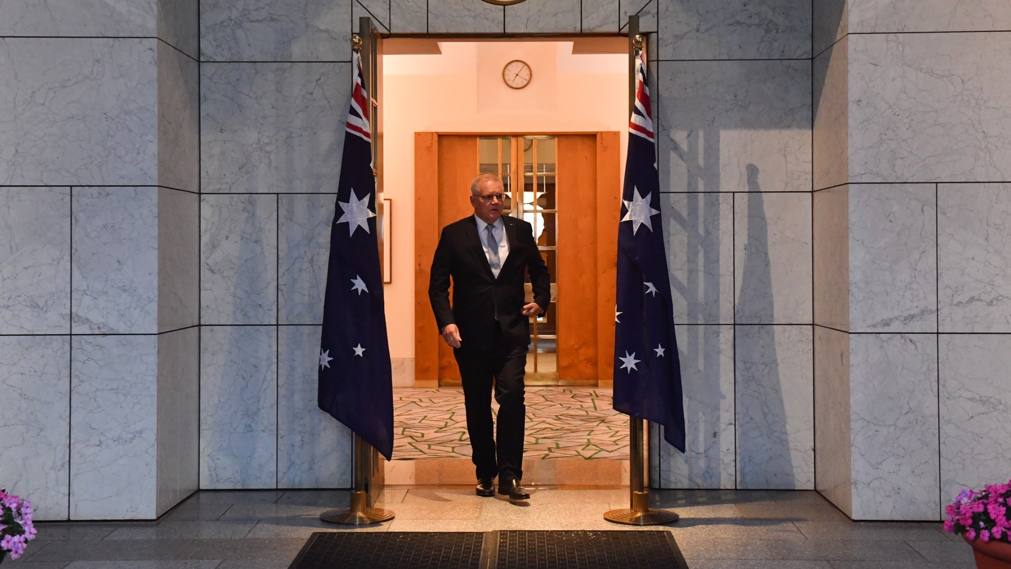 epa09859497 Prime Minister Scott Morrison arrives to be interviewed for morning television shows in the Prime Minister&#039;s courtyard at Parliament House in Canberra, Australia, 30 March 2022.  EPA/MICK TSIKAS   AUSTRALIA AND NEW ZEALAND OUT